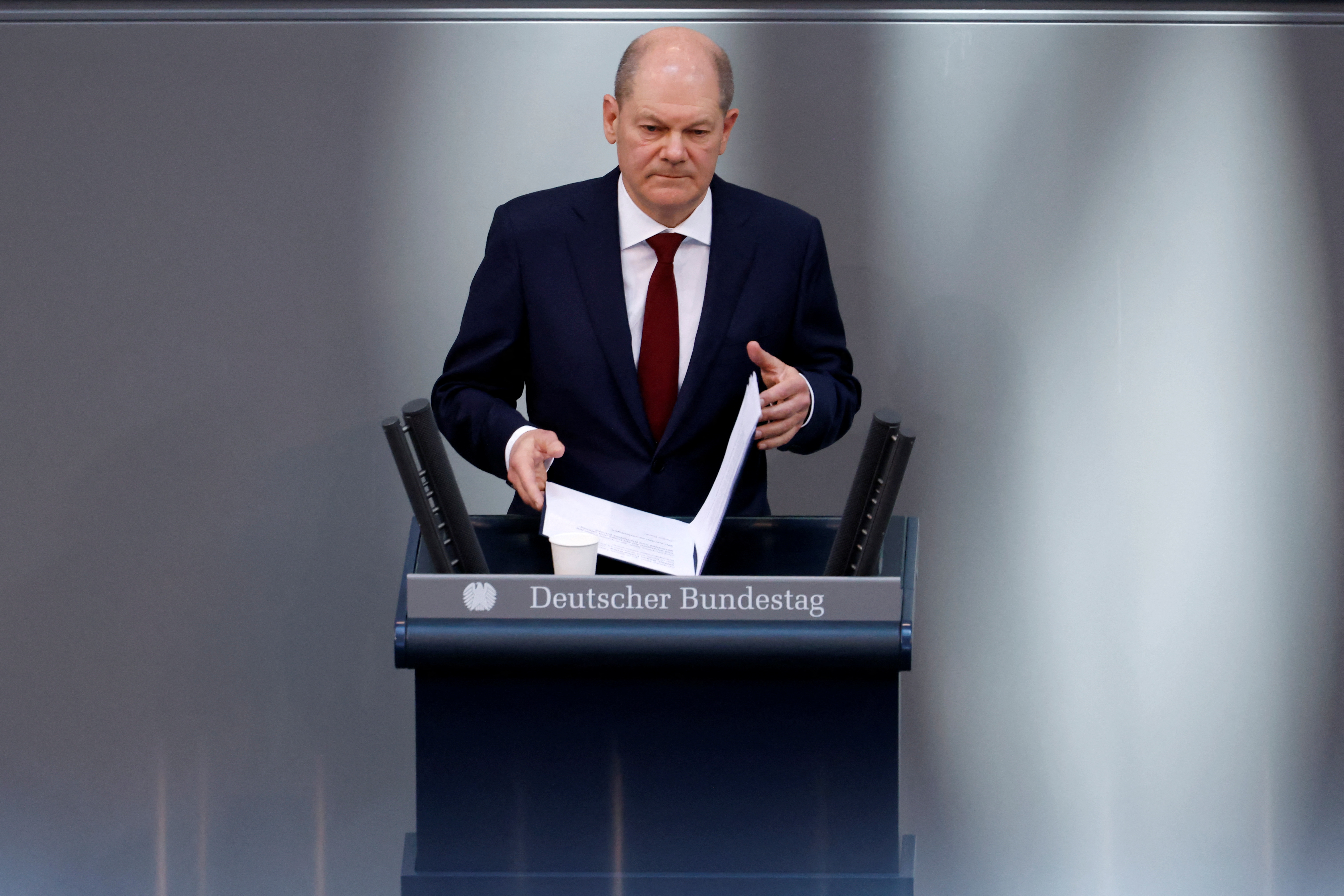 German Chancellor Olaf Scholz addresses an extraordinary session, after Russia launched a huge military operation against Ukraine, at the lower house of parliament Bundestag in Berlin, Germany
