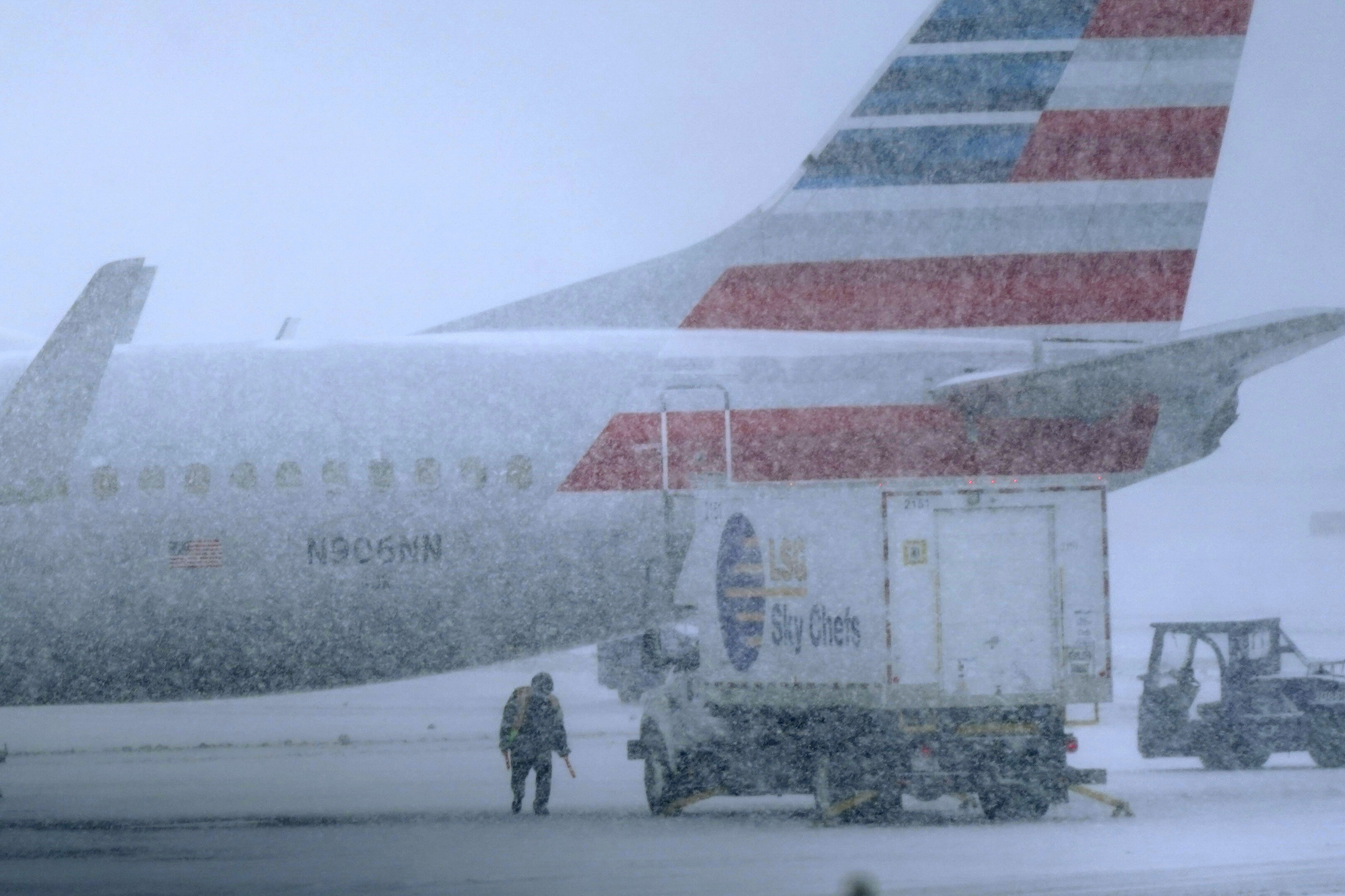 More snow was forecast, but it was the ice that threatened to wreak havoc on travel and electric service in the Northeast before the storm heads out