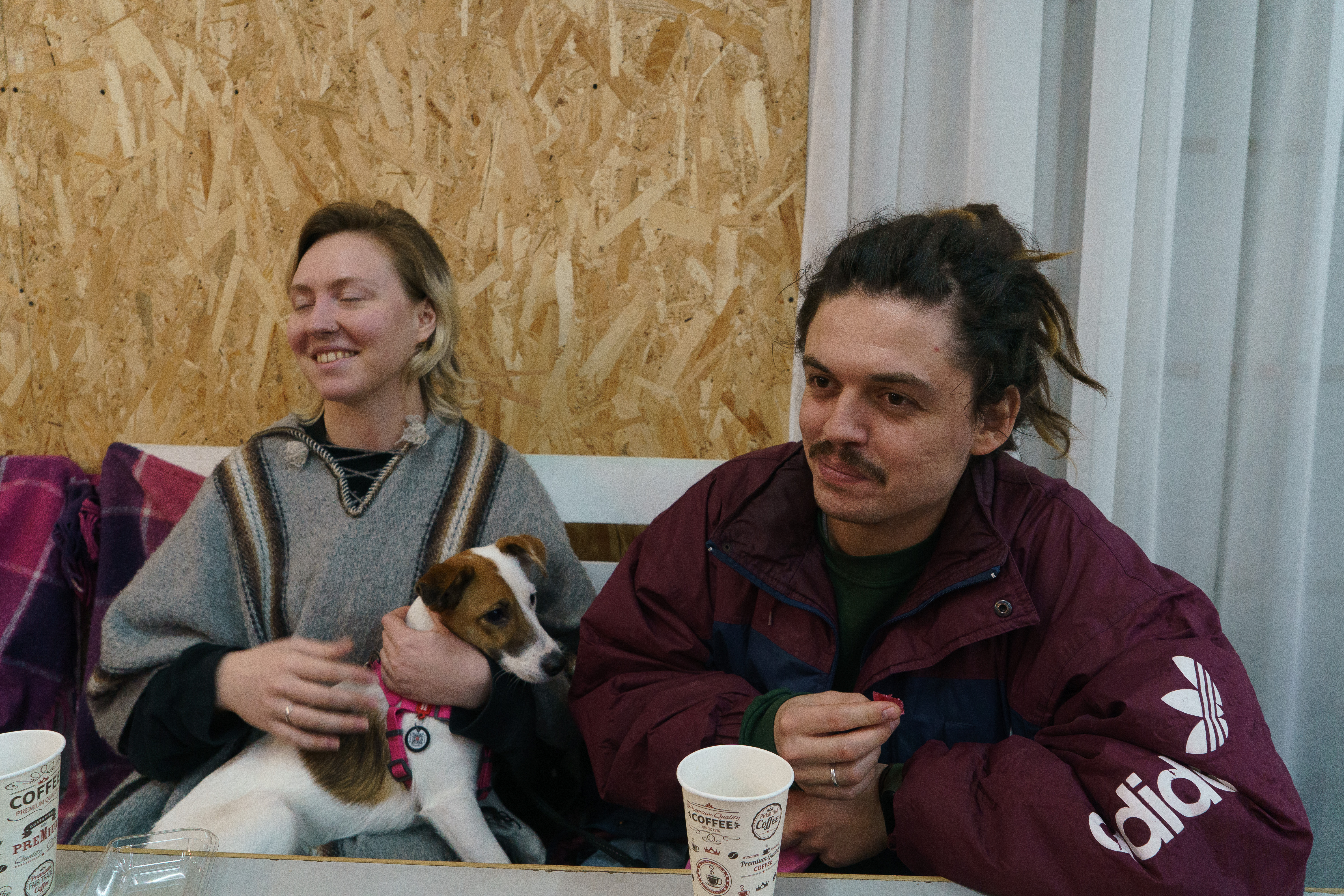 Two men sitting at a diner table.