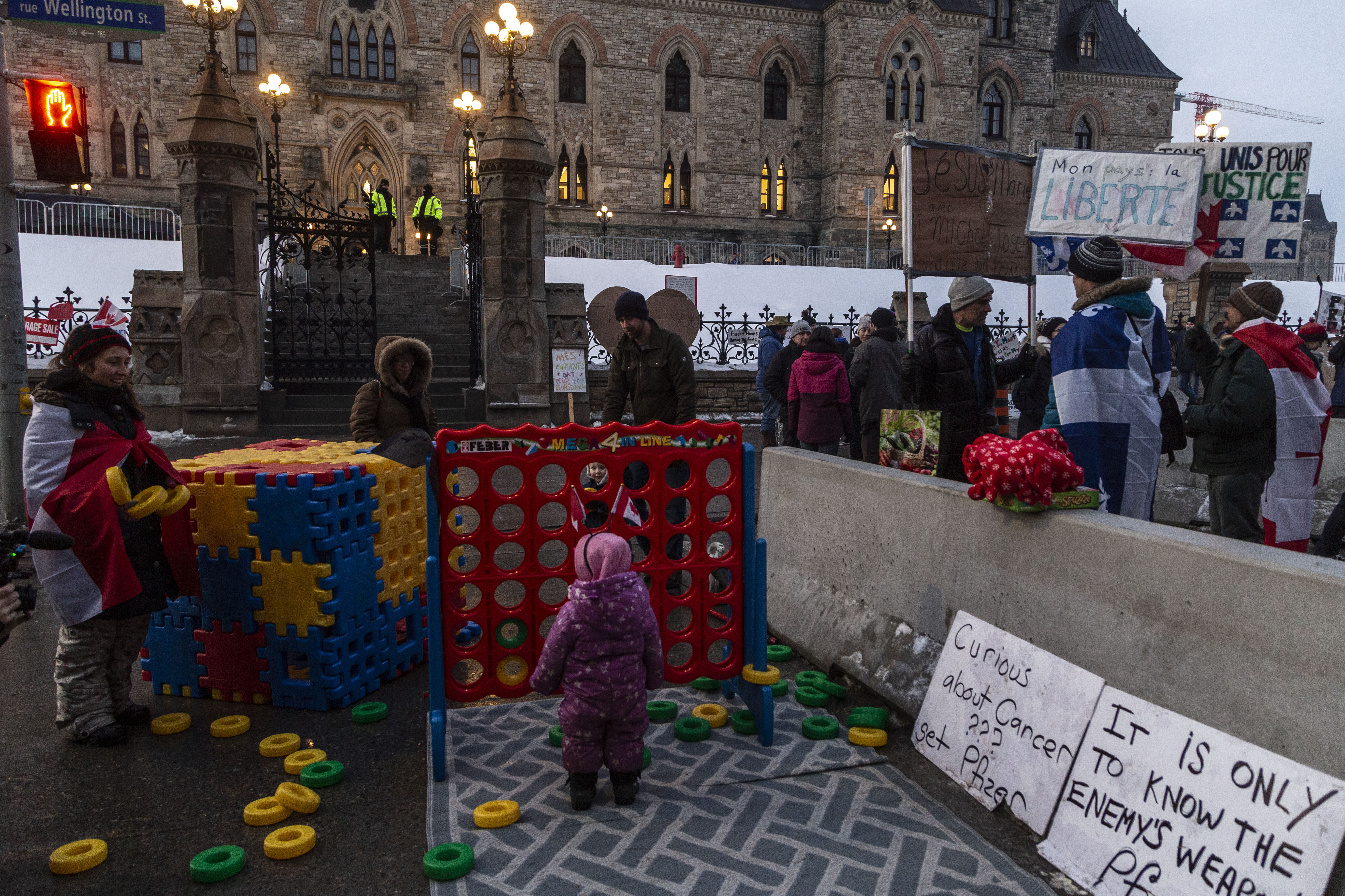 Children of protesters play in a makeshift outdoor kindergarten as Canadian truckers block the streets of Ottawa