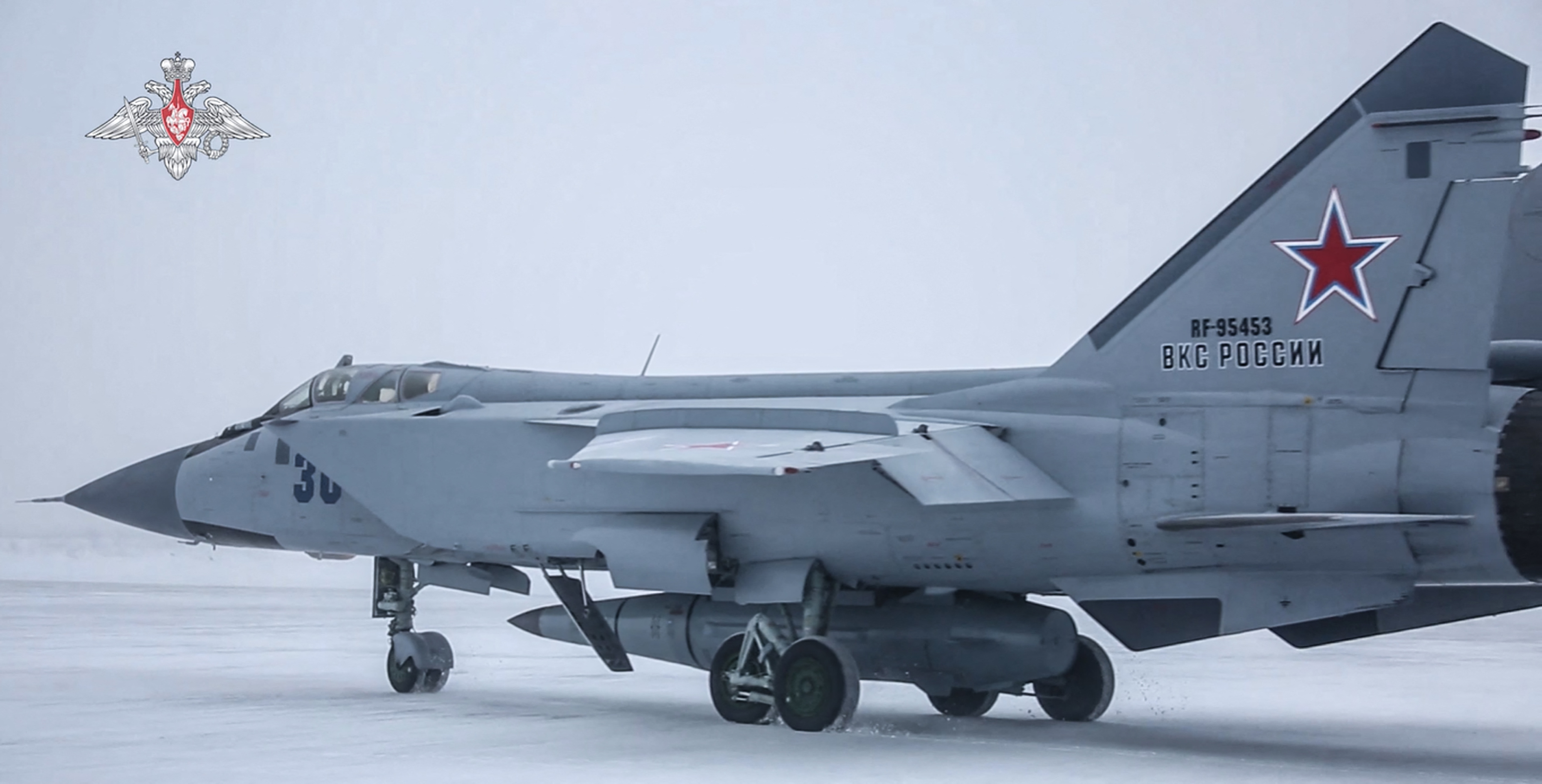 This handout video grab released by the Russian Defence Ministry on February 19, 2022, shows a MiG-31K fighter of the Russian air force carrying a Kinzhal hypersonic cruise missile