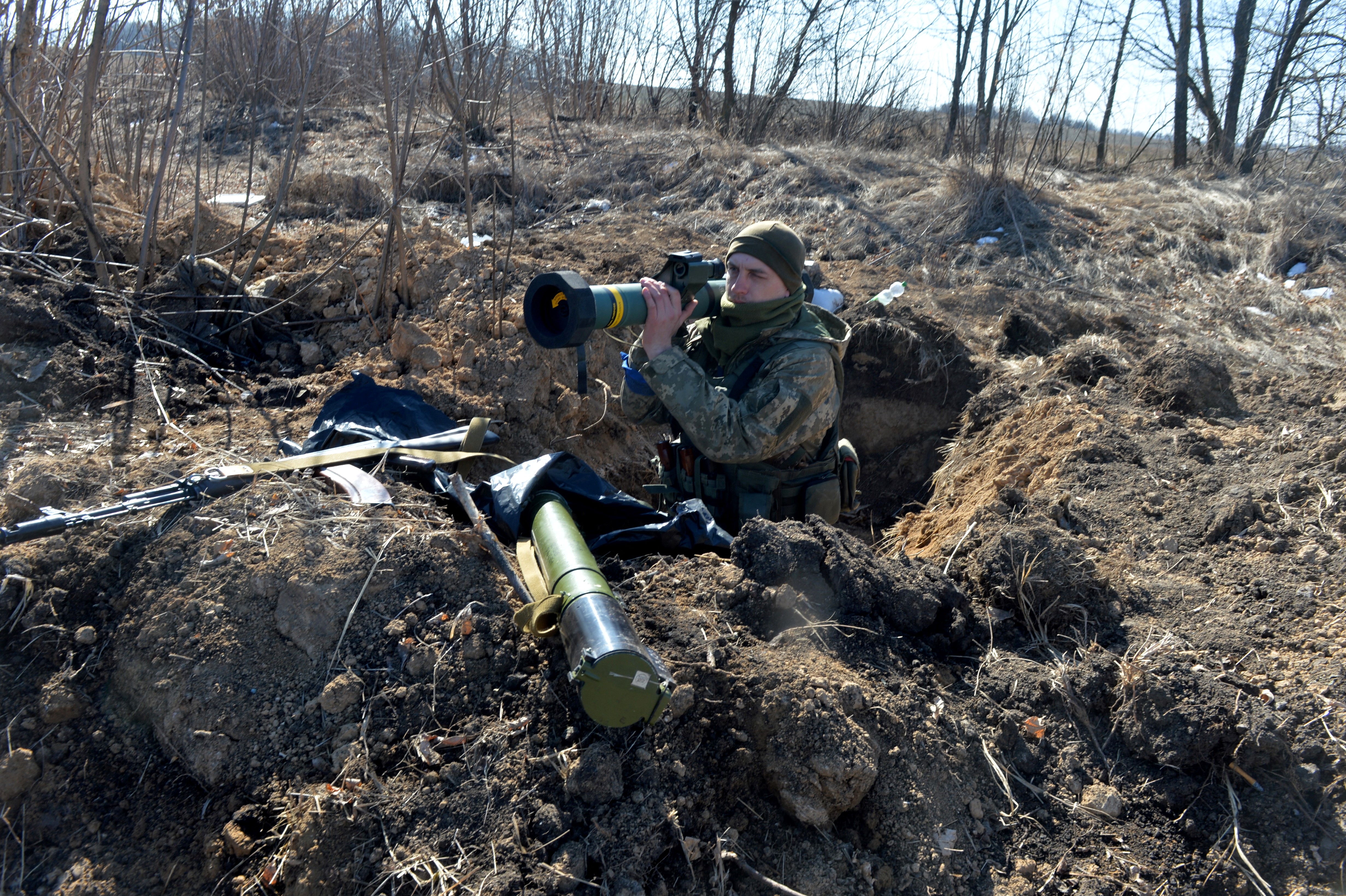 A member of the Ukrainian military forces holds a Javelin anti-tank missile at a checkpoint near Kharkiv