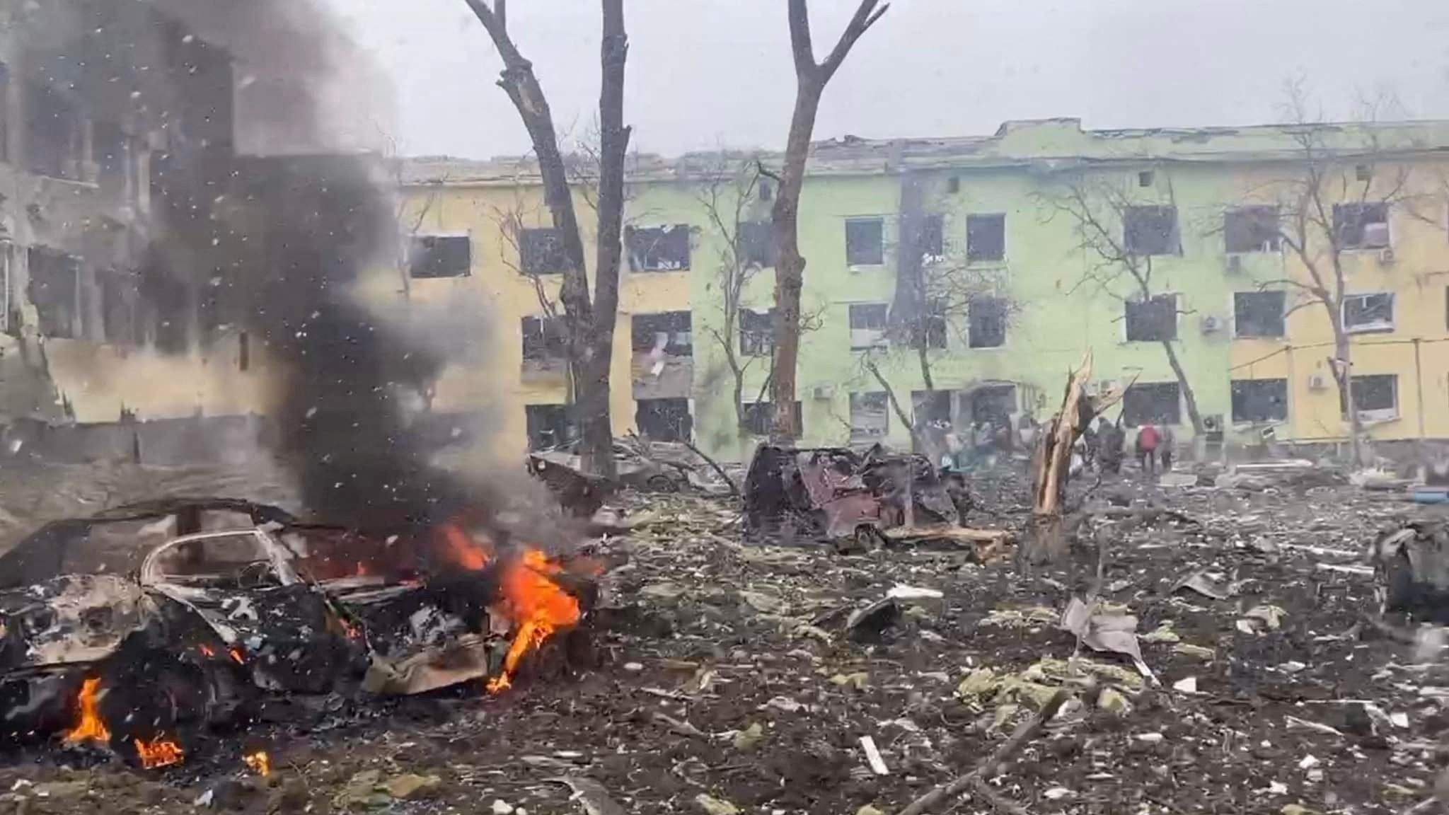 A view shows cars and a building of a hospital destroyed by an aviation strike amid Russia’s invasion of Ukraine, in Mariupol, Ukraine