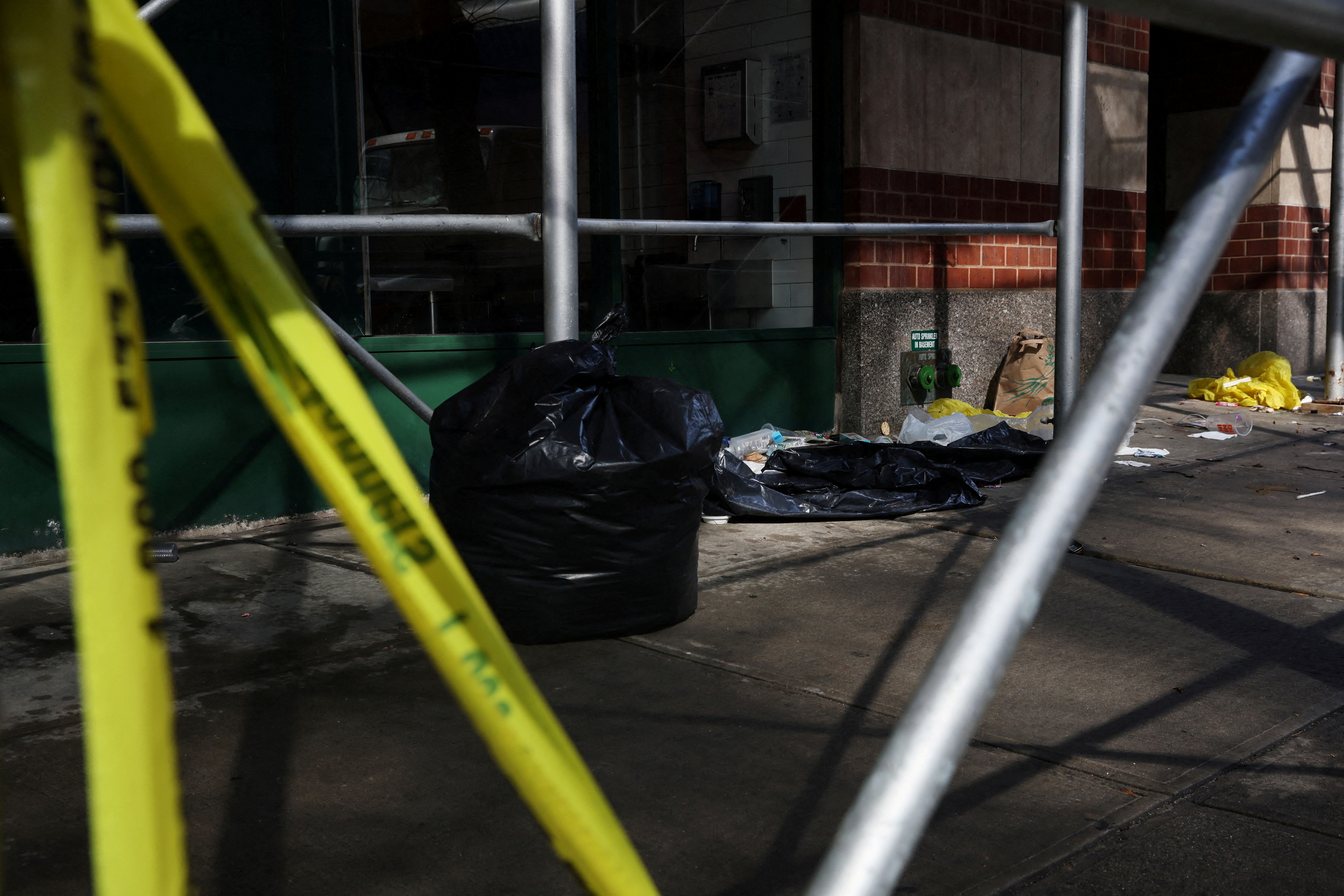 New York Police Department (NYPD) yellow tape marks off an area where a 43-year-old man was found dead on Sunday evening in New York City