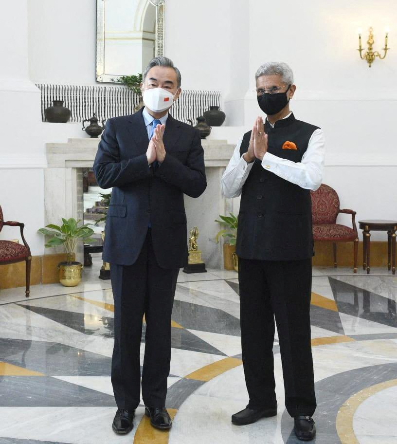 India’s Foreign Minister Subrahmanyam Jaishankar and his Chinese counterpart Wang Yi greet the media before their meeting in New Delhi