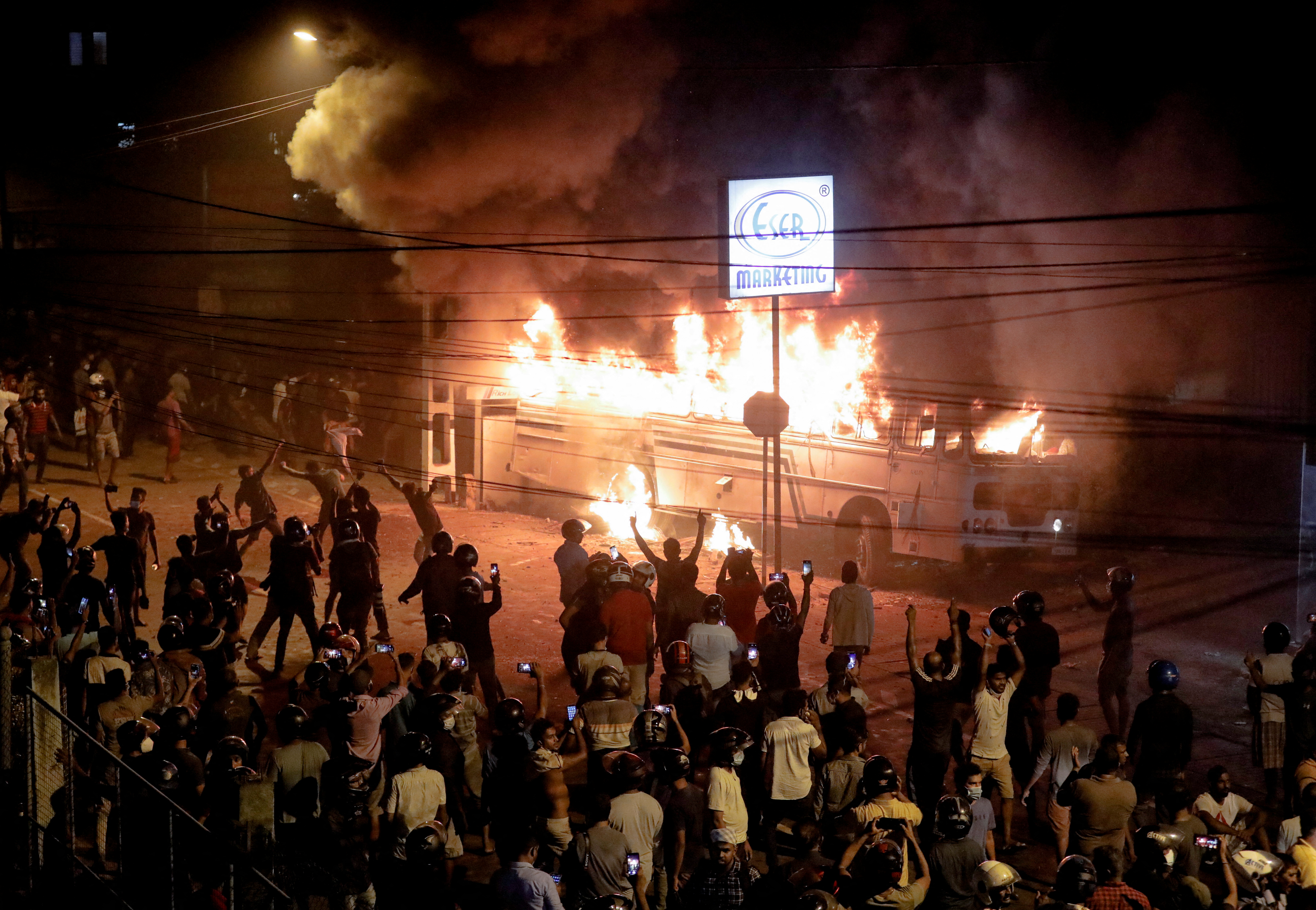 Protesters set fire to a bus parked at the road leading to President Gotabaya Rajapaksa’s residence as the crisis-hit country faced up to 13-hour electricity cuts