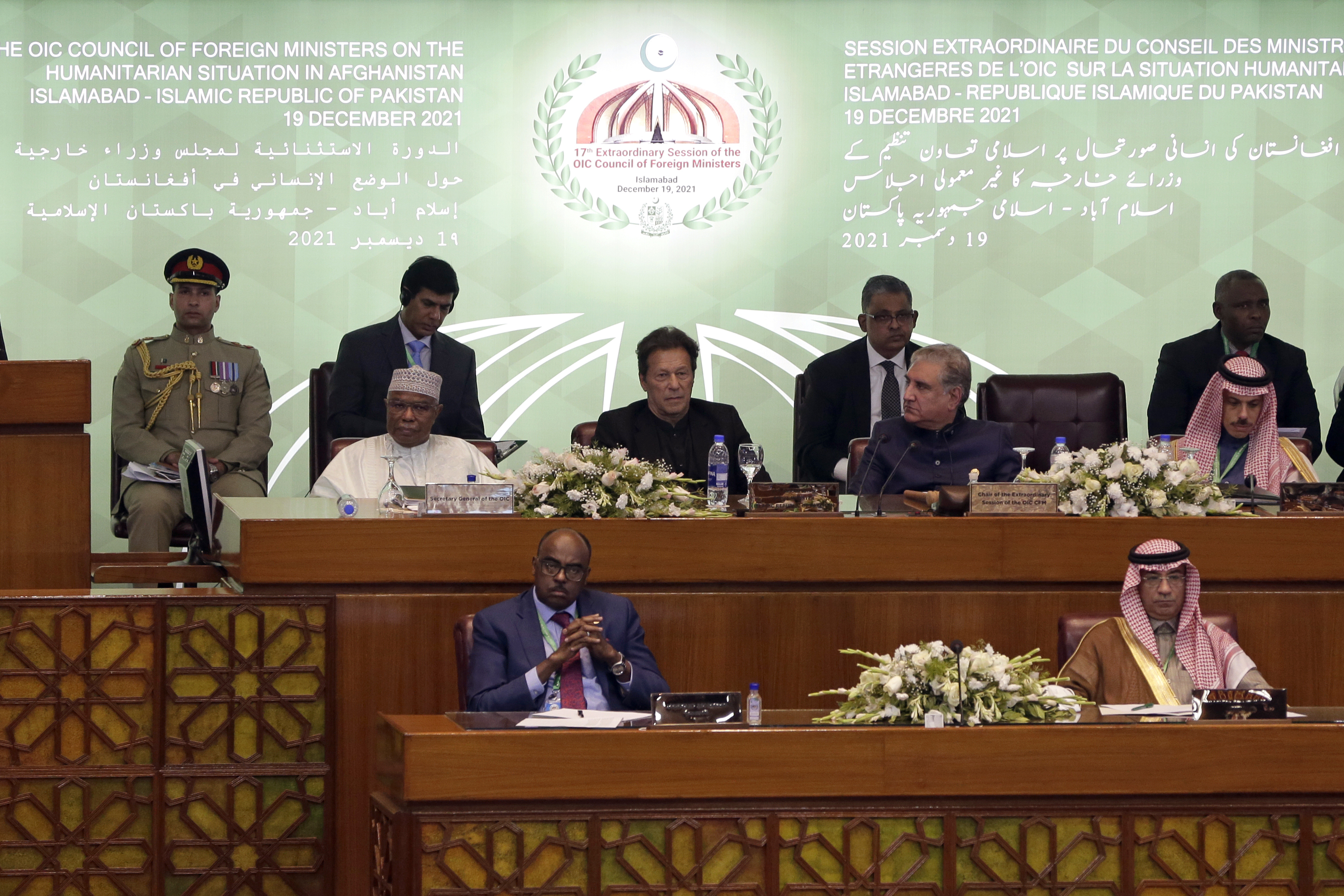 Khan, centre, attends the extraordinary session of OIC Council of Foreign Ministers in Islamabad