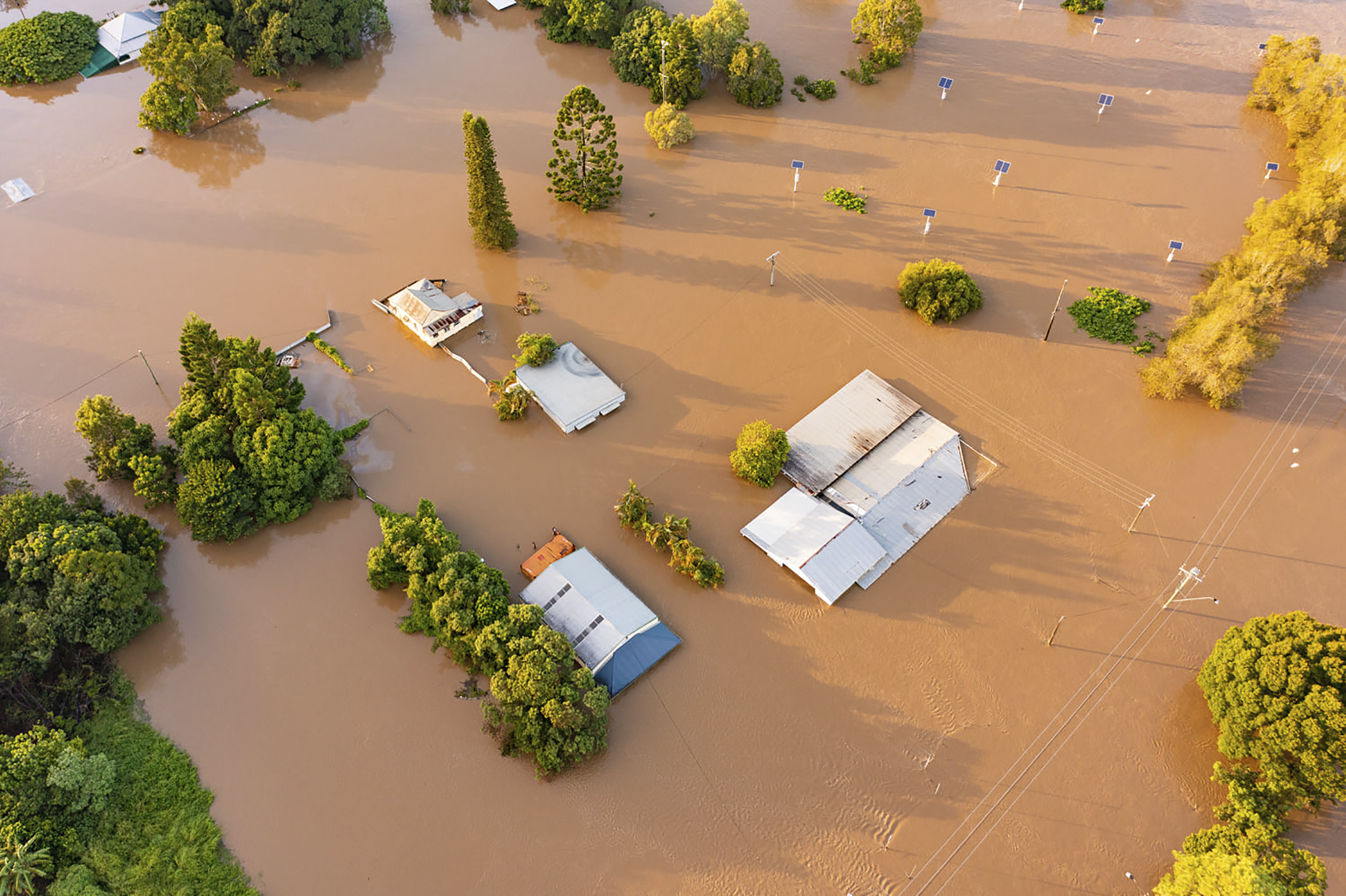 water floods streets and houses in Maryborough, Australia