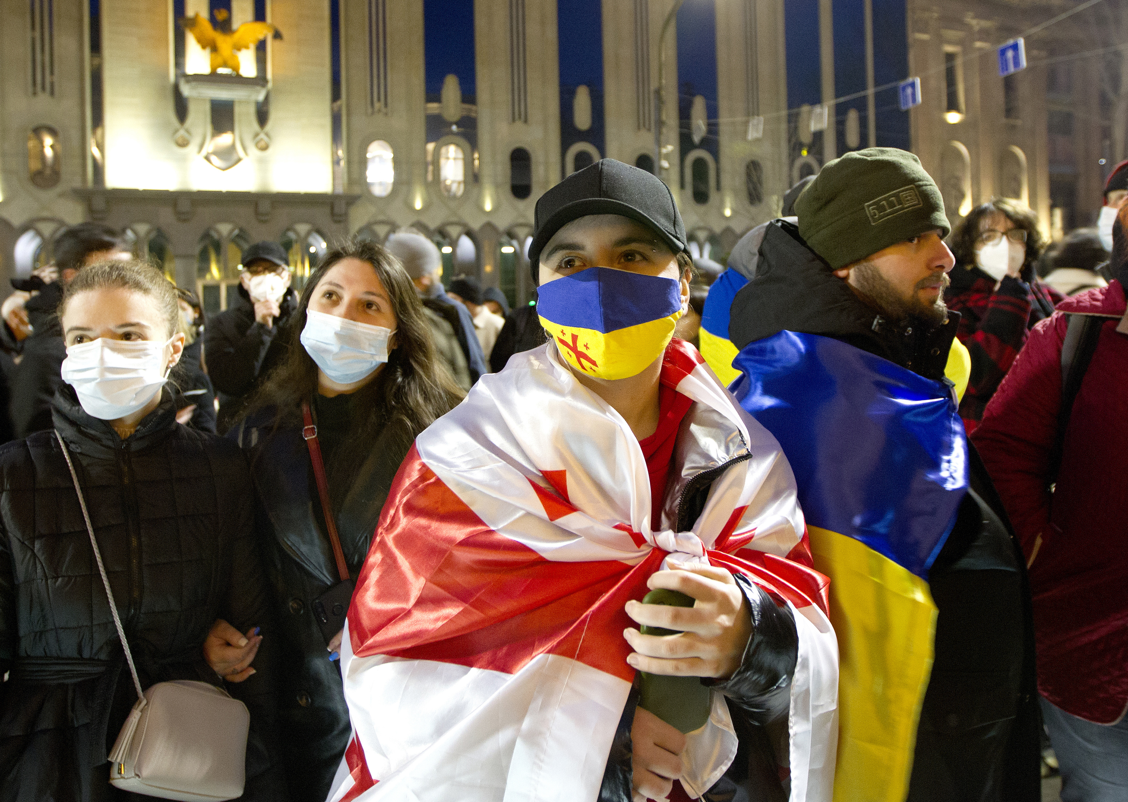 A demonstrator with the Ukraine and Georgia flags in Tbilisi