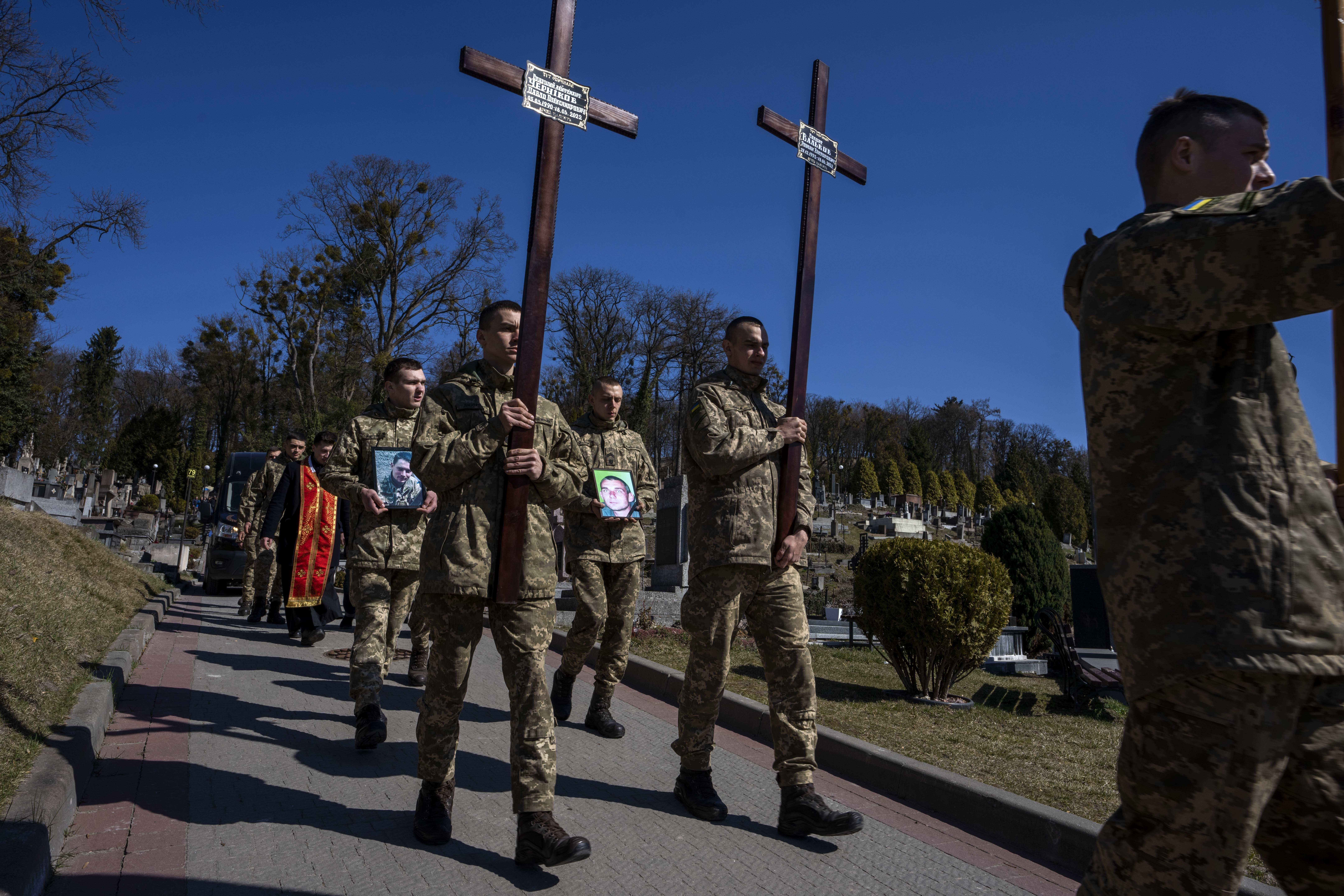 Ukrainian soldiers prepare to bury 32-year-old Senior Lieutenant Pavlo Chernikov