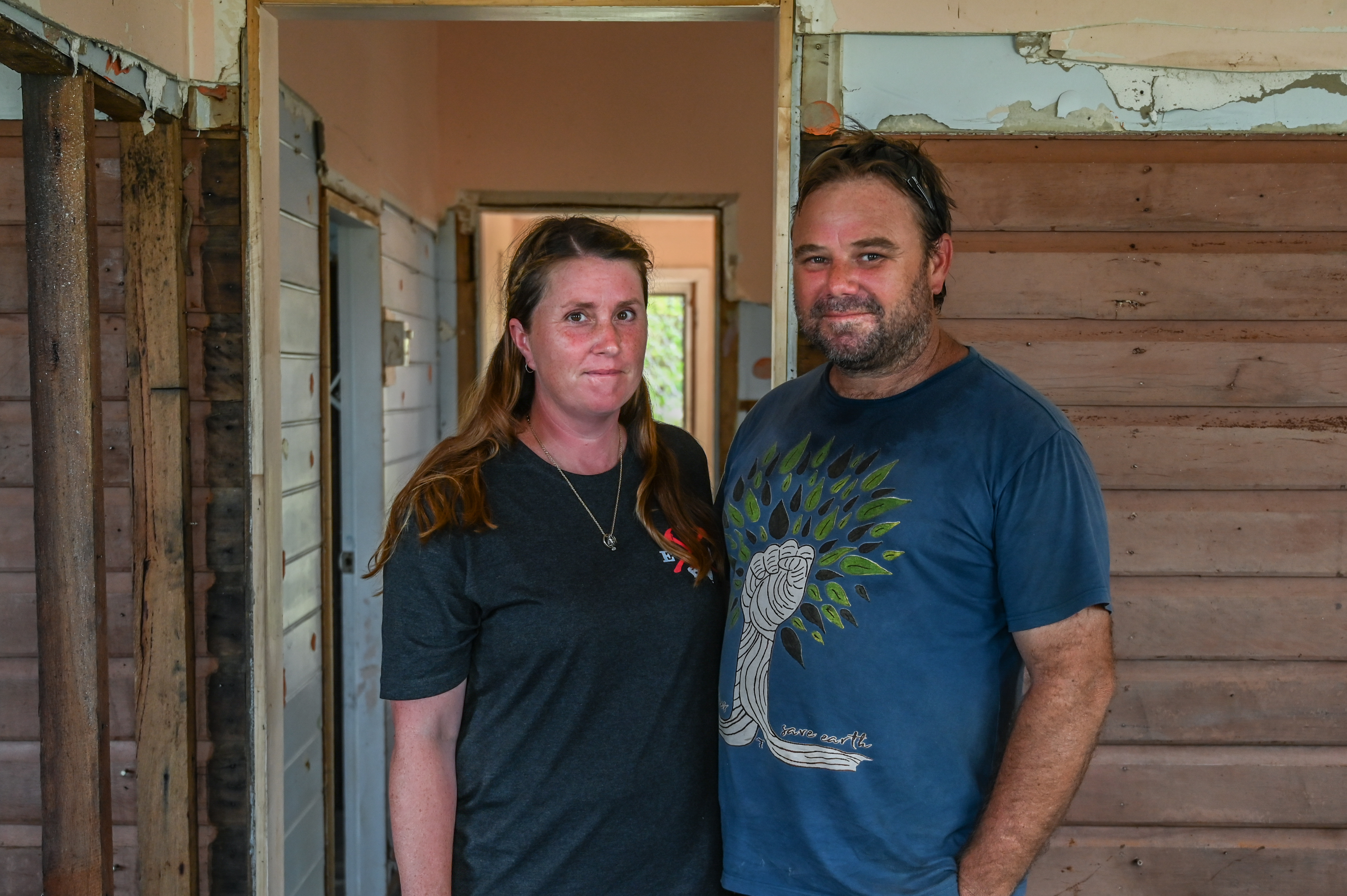 Nancy Grimm and Daniel Clark, two SES volunteers in Coraki, had to strip out their own house after it was damaged in the floods