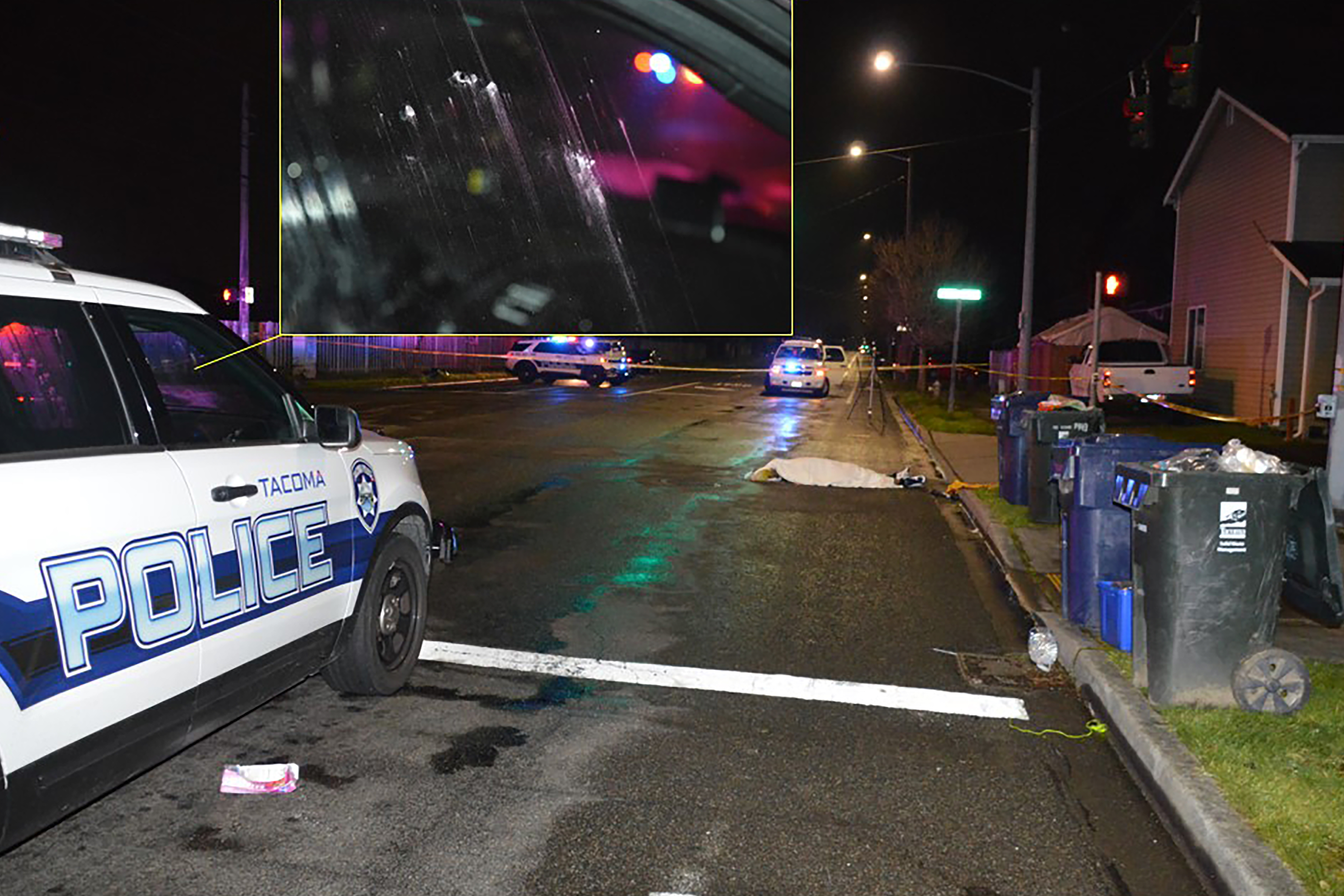 A box of smashed donuts, which Manuel Ellis purchased from the 7-Eleven shortly before he was killed, is pictured beneath a Tacoma police cruiser, near his body, on March 3, 2020 [Washington State Police]