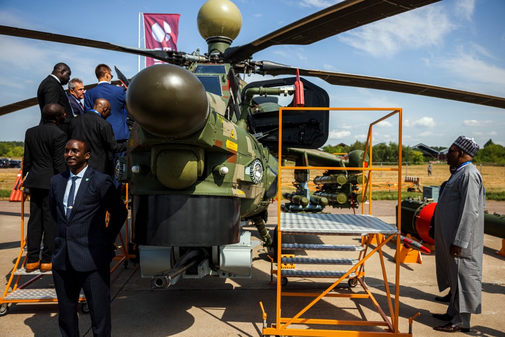 Members of a Nigerian delegation inspect a Russian Mil Mi-28NE Night Hunter military helicopter during the opening day of the MAKS-2021 International Aviation and Space Salon at Zhukovsky outside Moscow on July 20, 2021