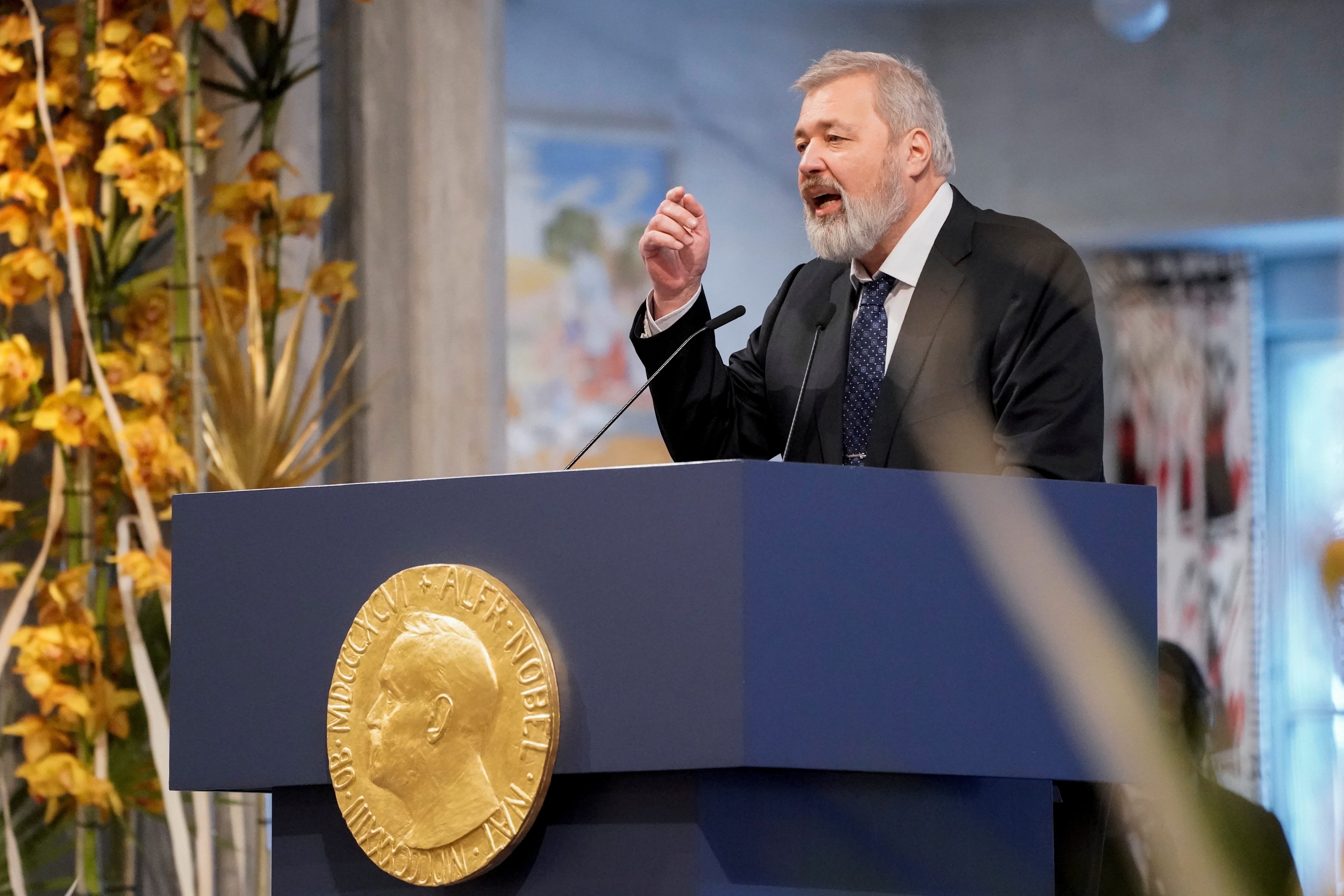 Dmitry Muratov speaking at podium
