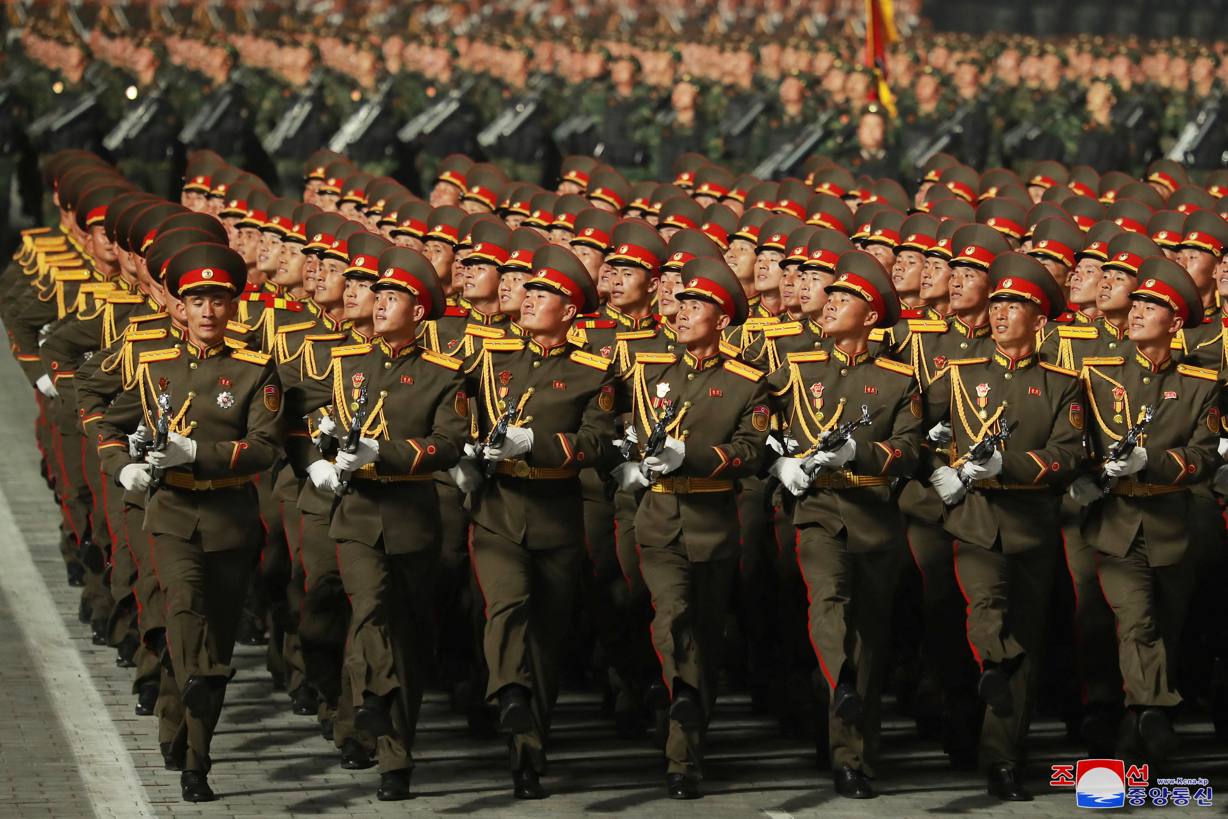 A march past to mark 90 years since the founding of the Korean People’s Revolutionary Army [KCNA via Reuters]