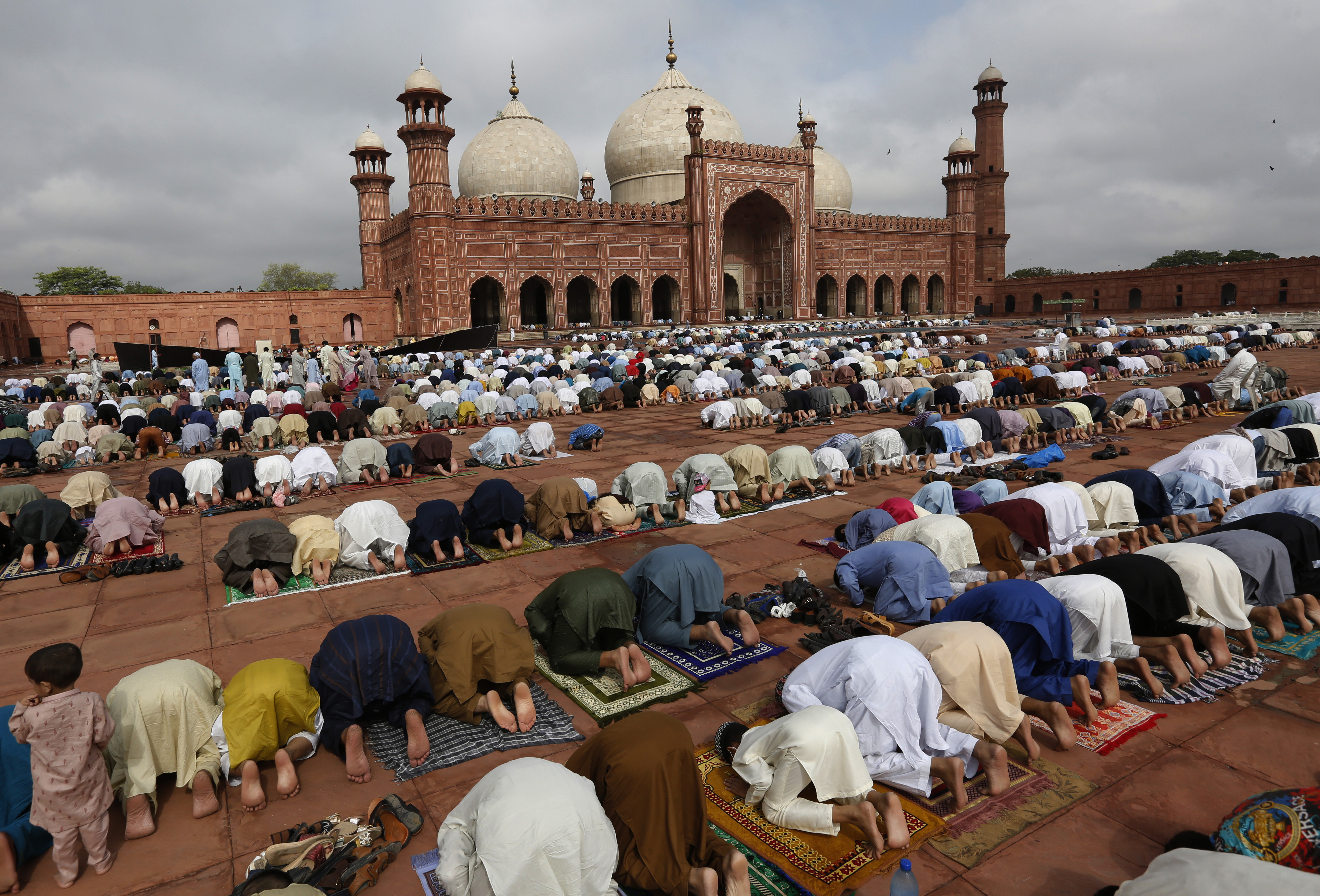 People attend Eid prayers at the historic Badshahi Mosque in Lahore, Pakistan