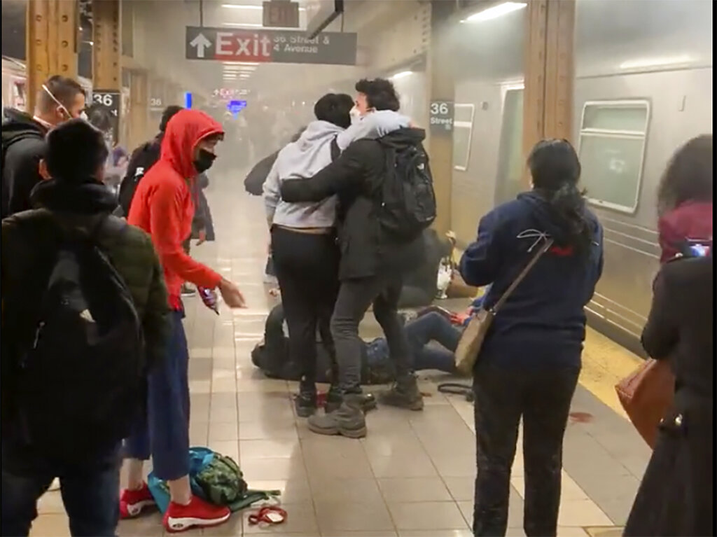 People rushed to aid wounded commuters bleeding on a Brooklyn platform as others ran from the car to another train [Will B Wylde via AP]