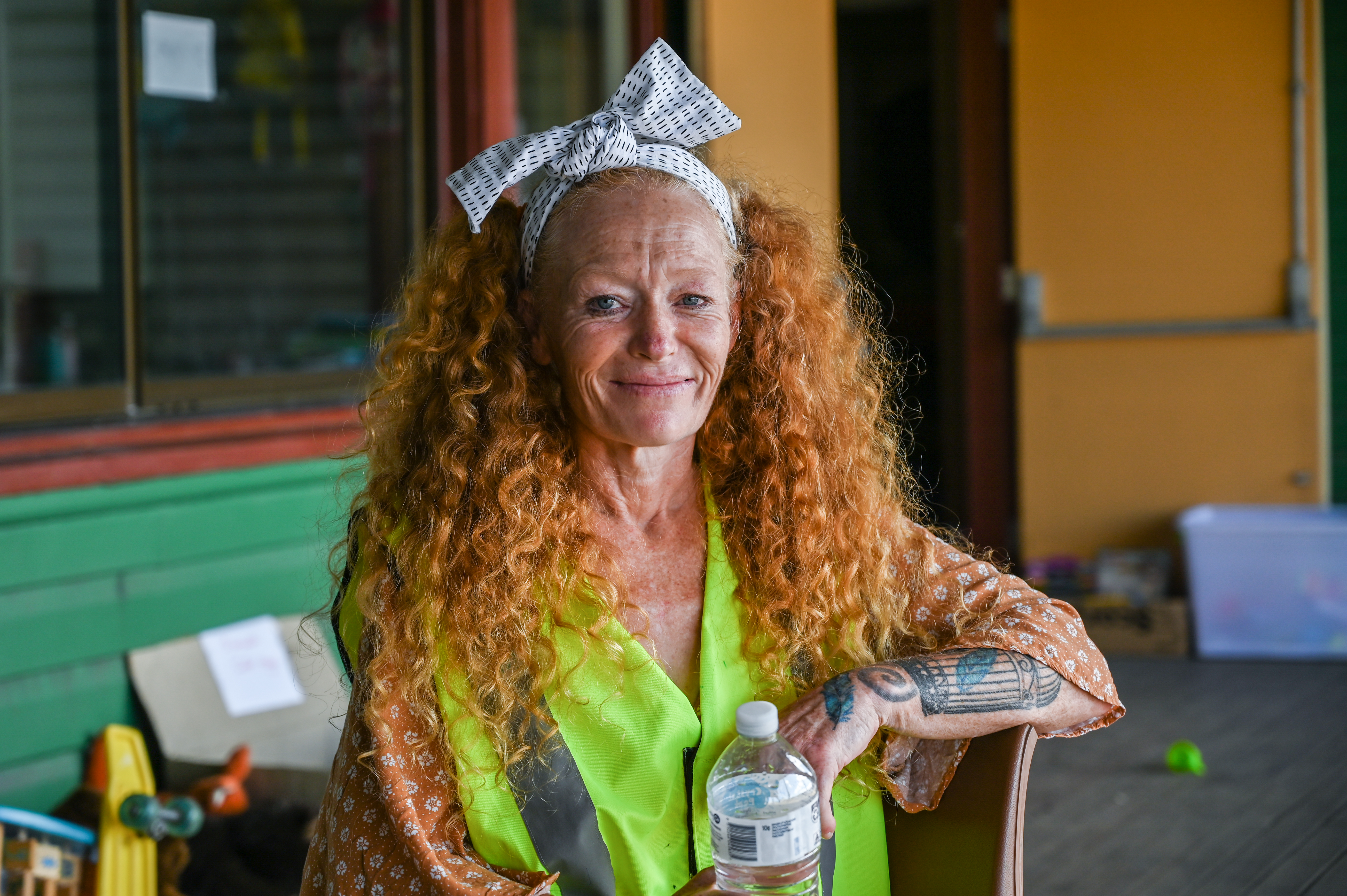 MJ, a Woodburn resident, sits outside the donation centre where she is currently volunteering