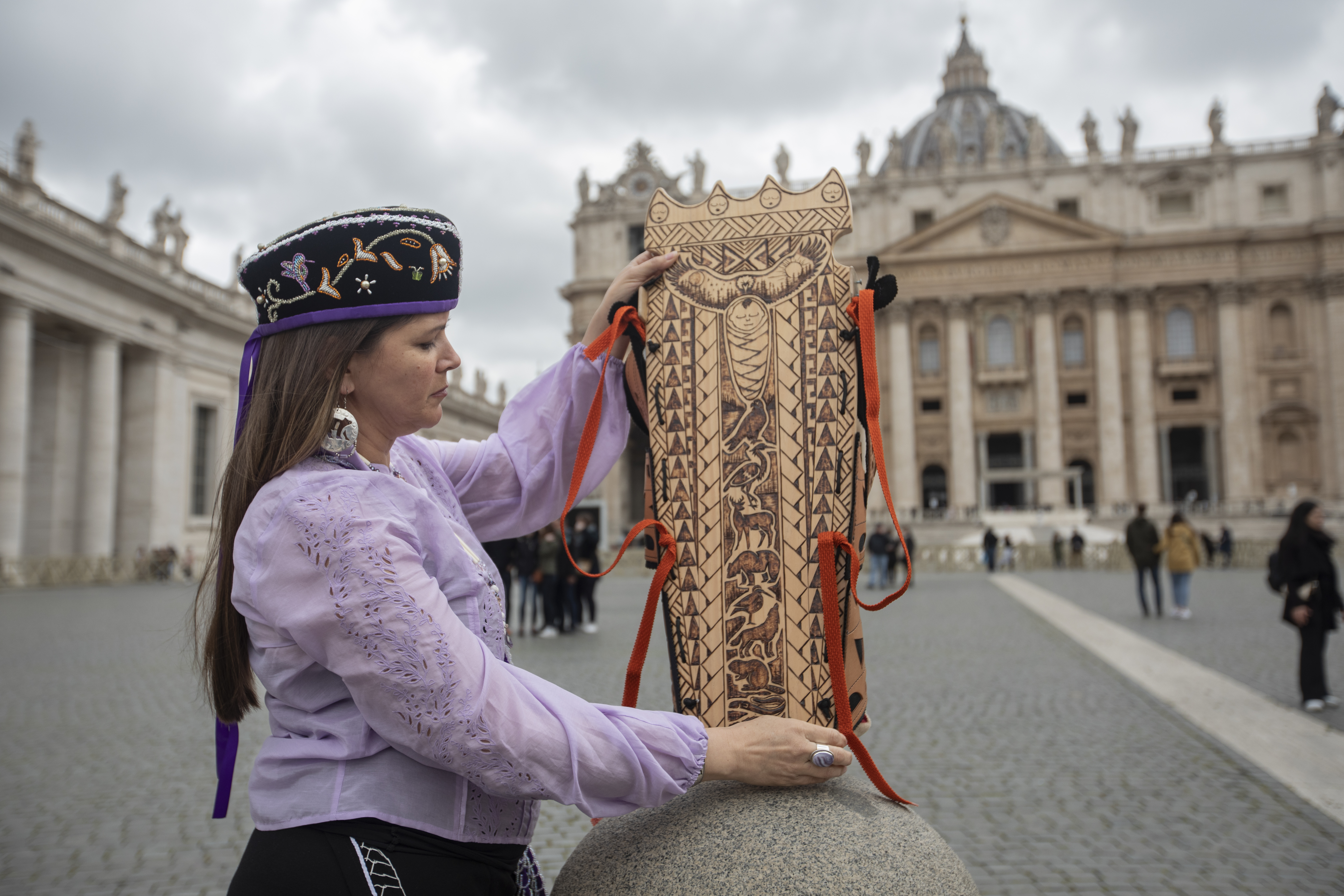 Michelle Schenandoah, a member of Oneida Nation of the Haudenosaunee confederacy, shows the empty cradleboard she left overnight with Pope Francis in Rome, Italy on April 1, 2022