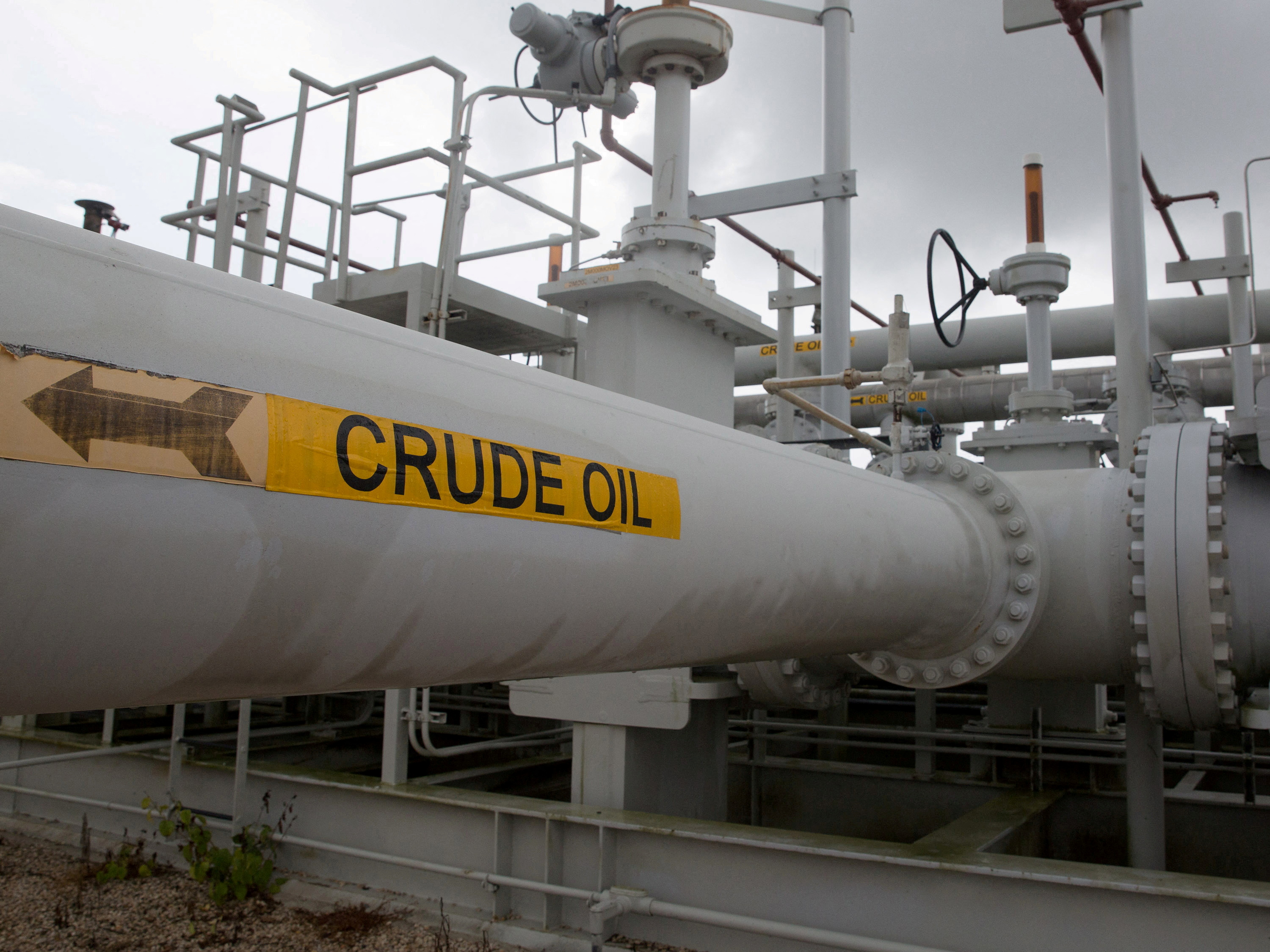 A maze of crude oil pipes and valves is pictured