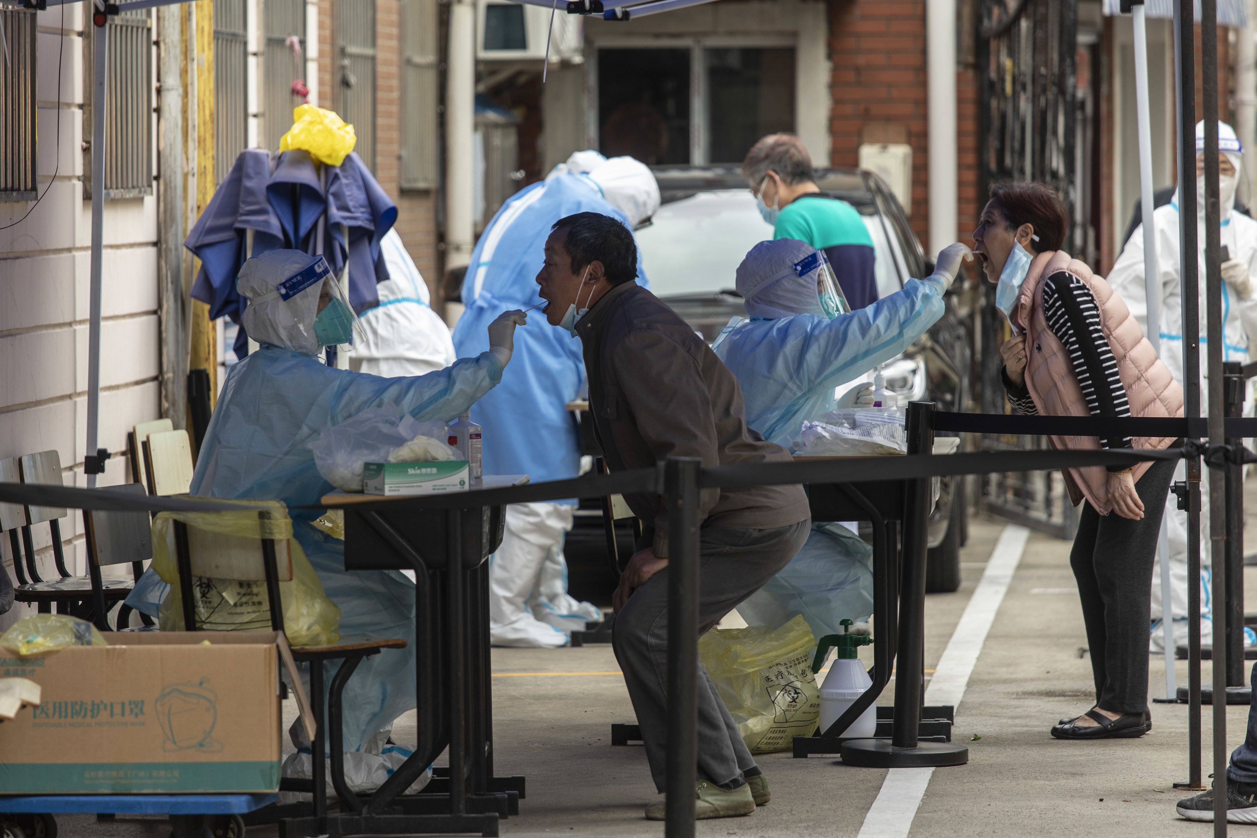 Residents take part in a round of COVID-19 testing during a lockdown in Shanghai, China