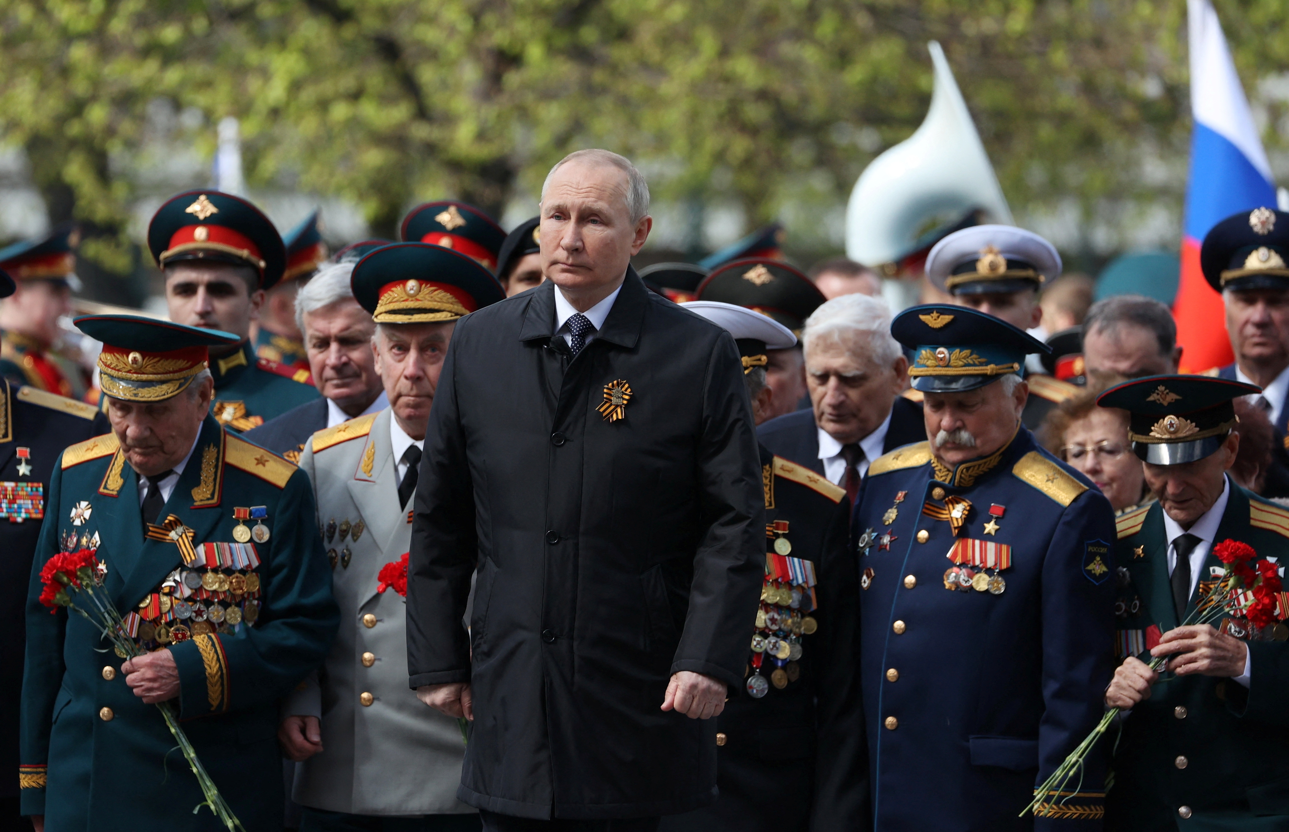 Russian President Vladimir Putin attends a flower-laying ceremony