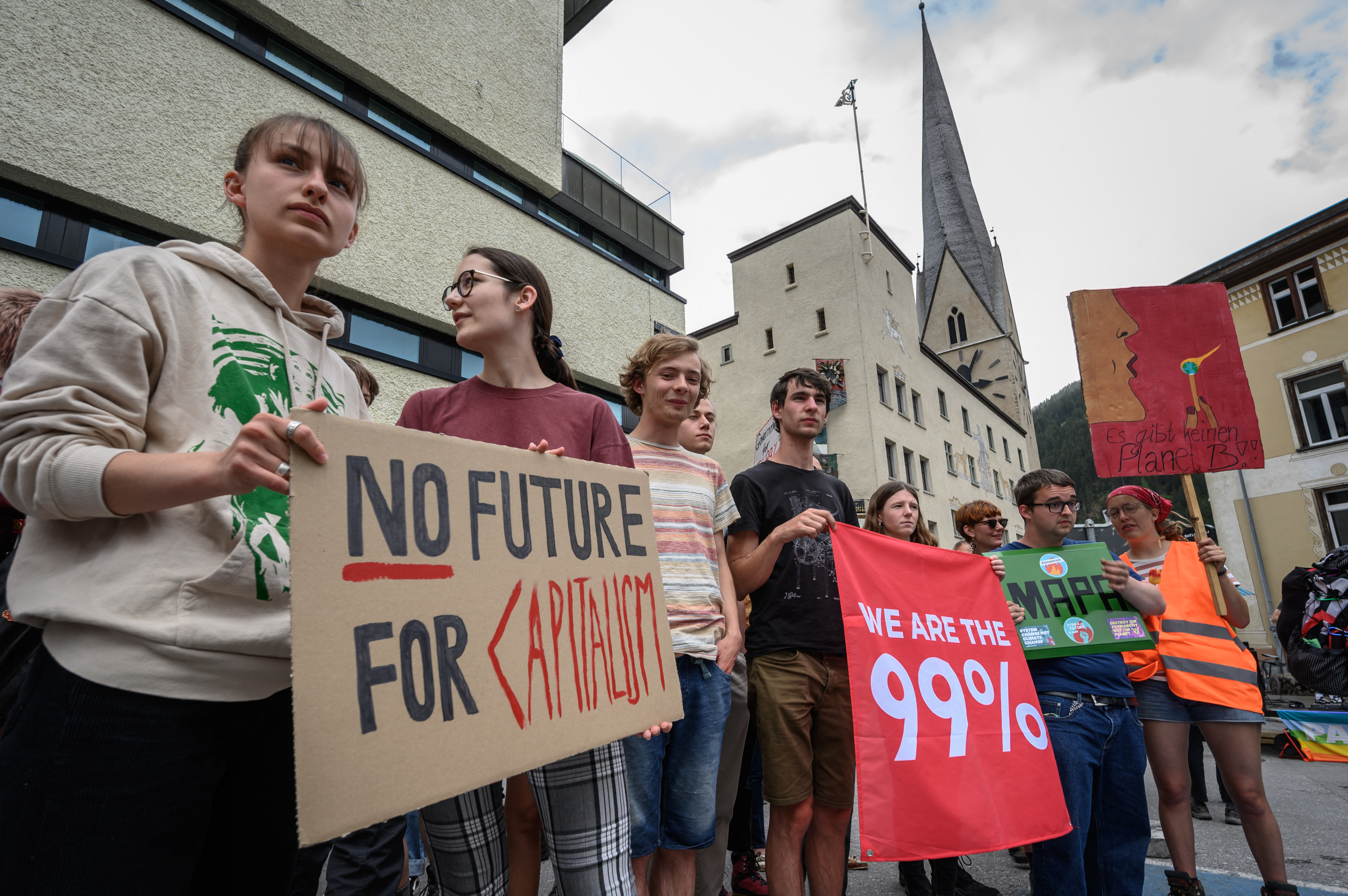 Young protesters take part in a demonstration against the World Economic Forum on Sunday