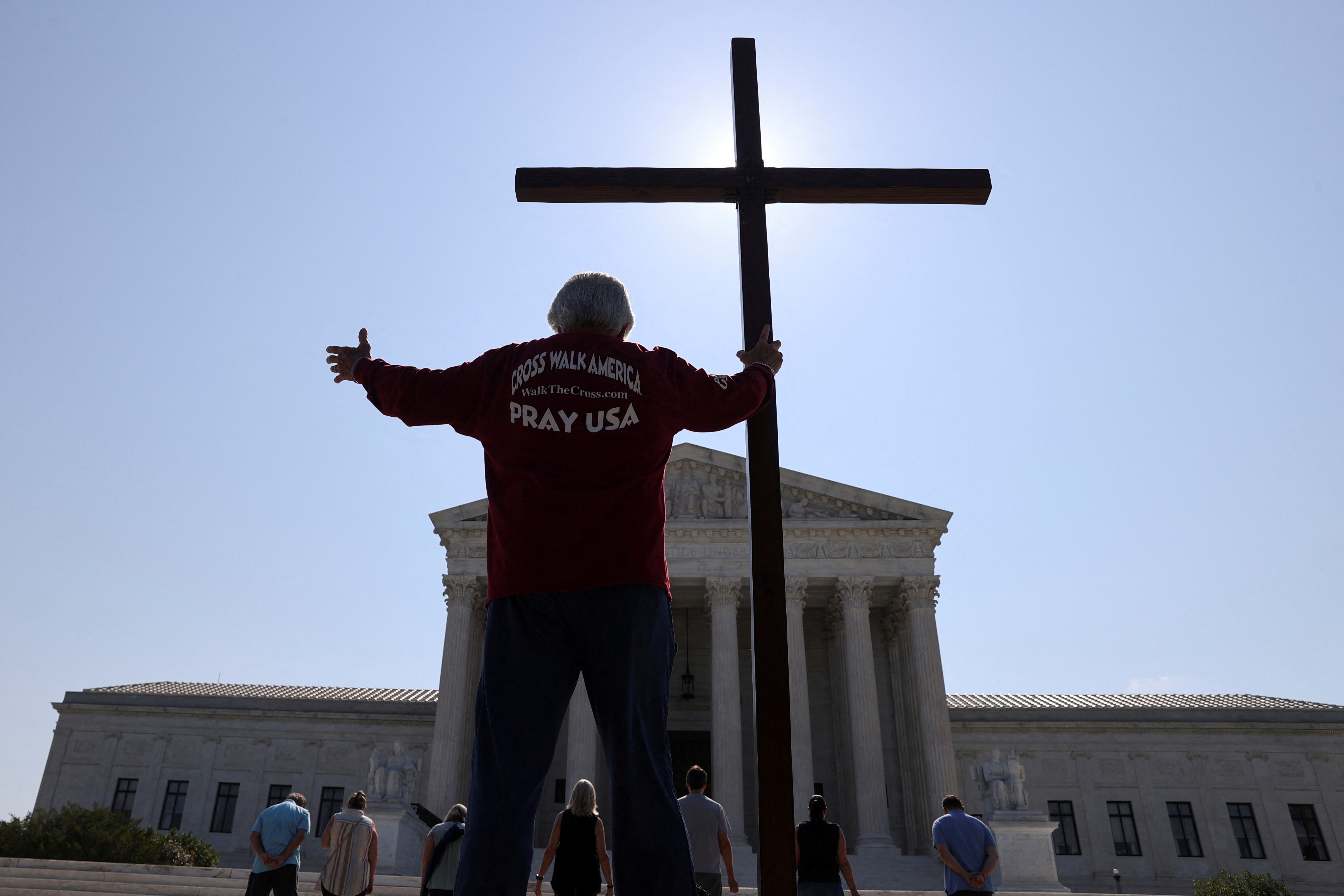 Man carrying cross
