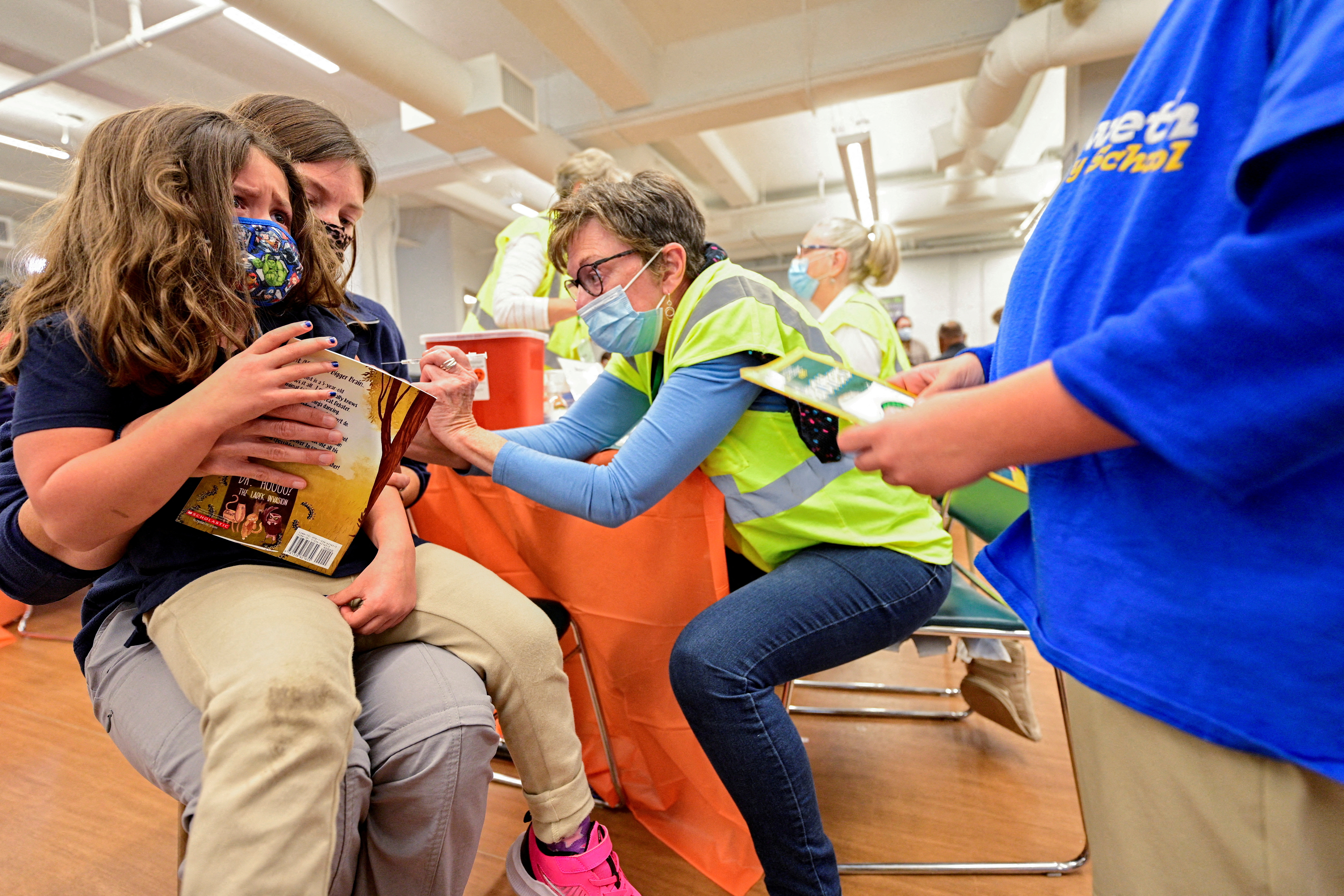 A child getting a covid shot.