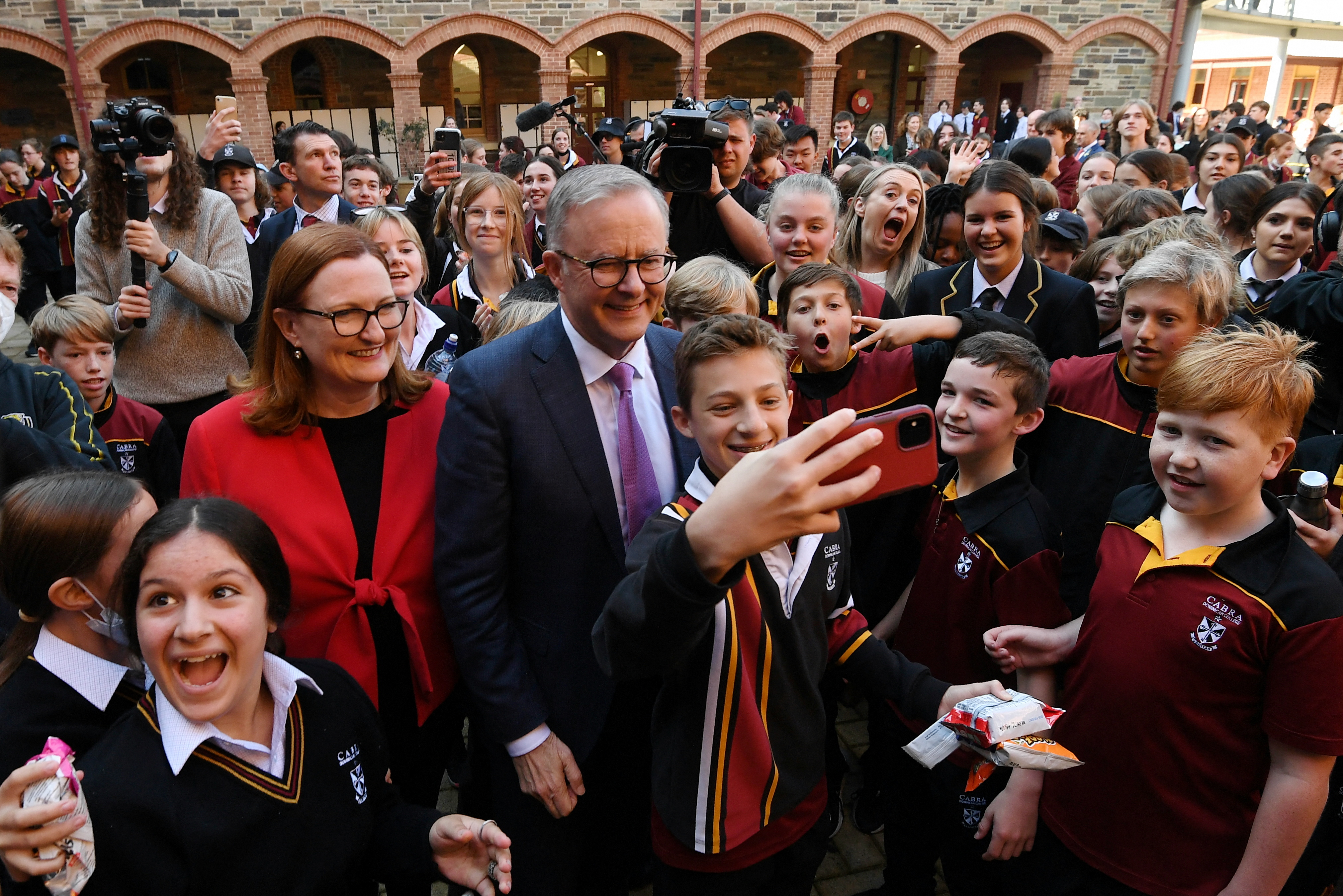 Anthony Albanese meets a crowd of supporters during a visit to a college in Adelaide