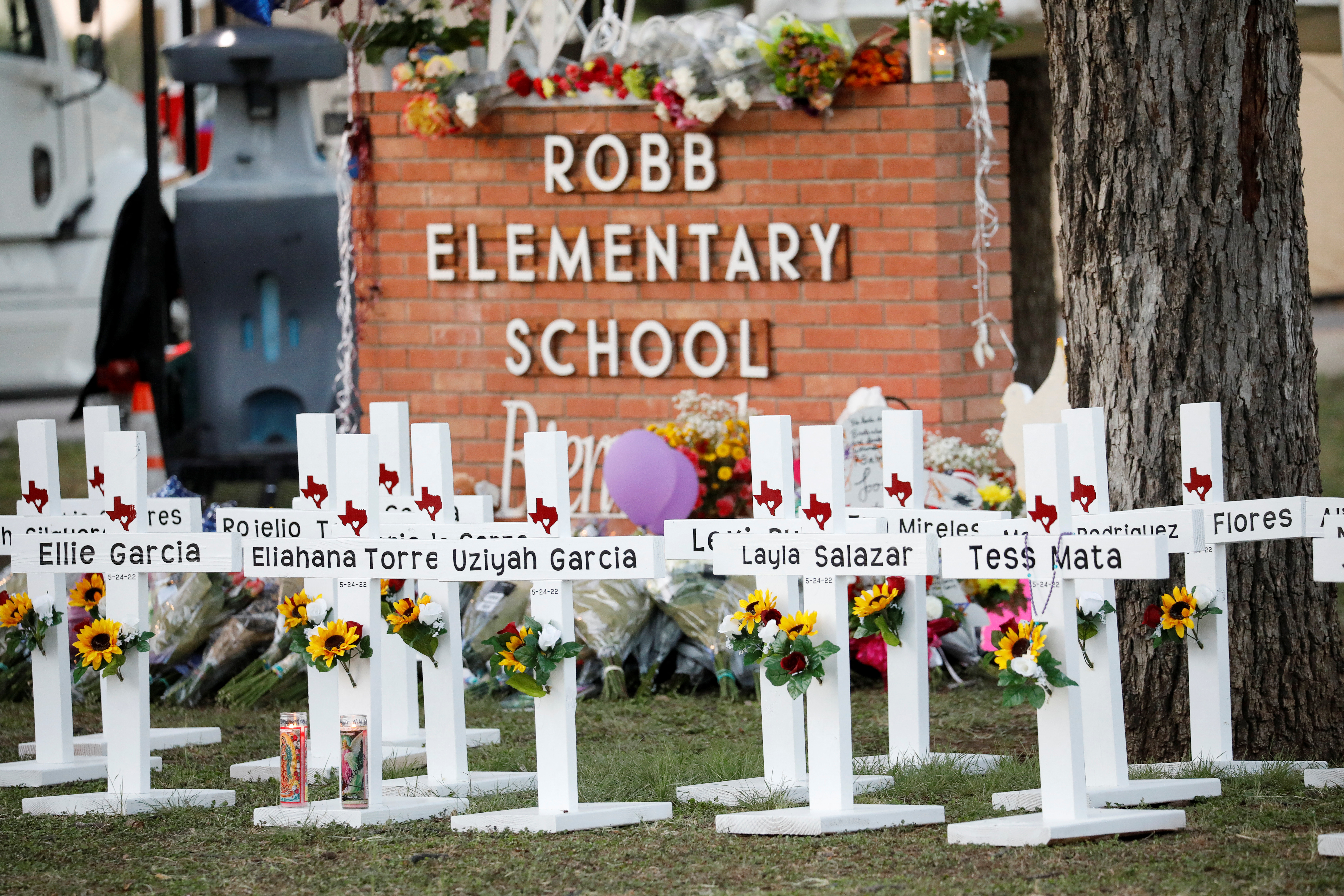 Crosses with the names of victims of a school shooting are pictured at a memorial outside Robb Elementary school, after a gunman killed 19 children and two teachers, in Uvalde, Texas