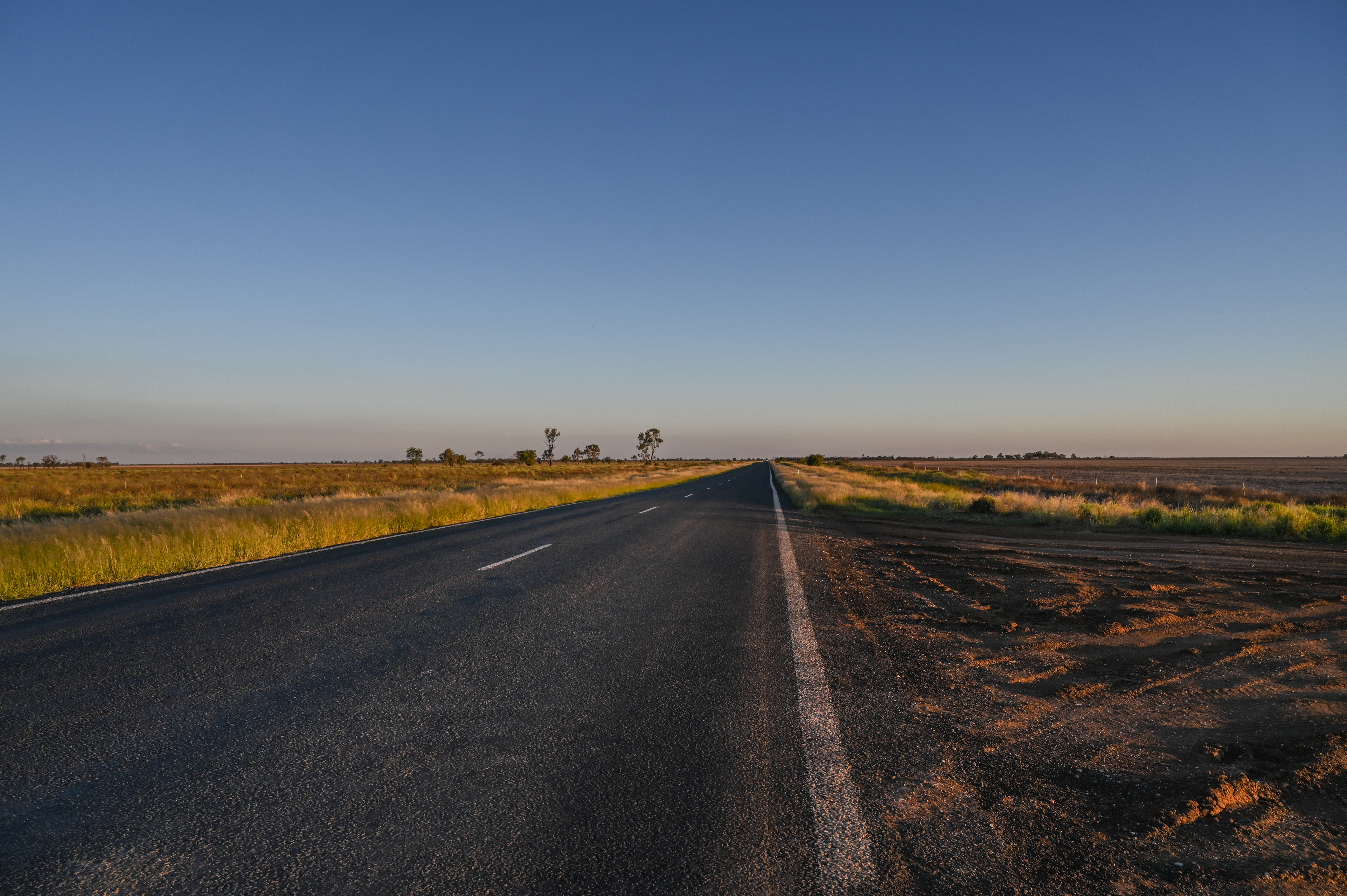 A photo of a road in sunset.