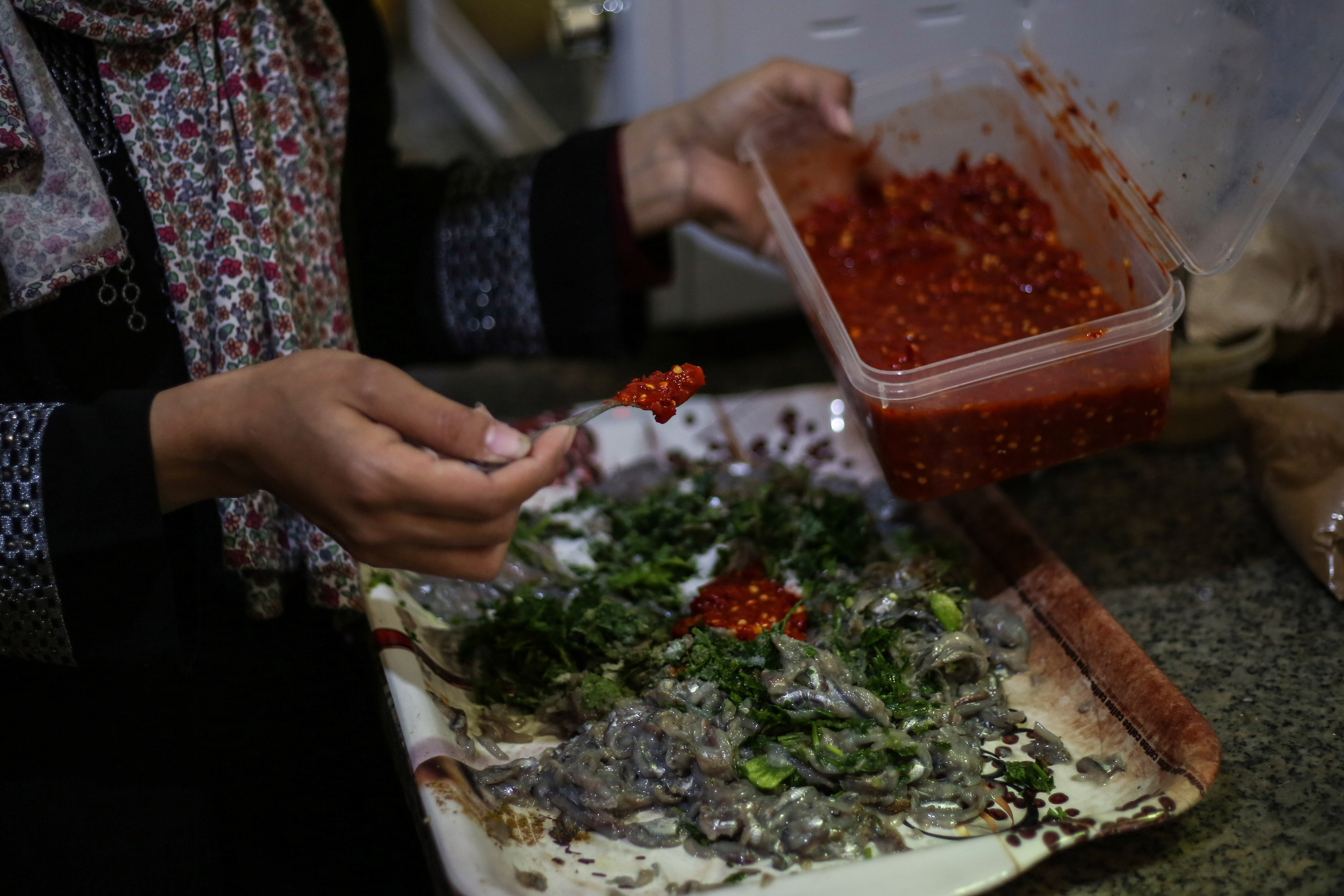 The bright red pepper paste, an essential in Gaza cooking, gives a distinct funky, slightly sweet and slightly spicy flavour to food, especially fish