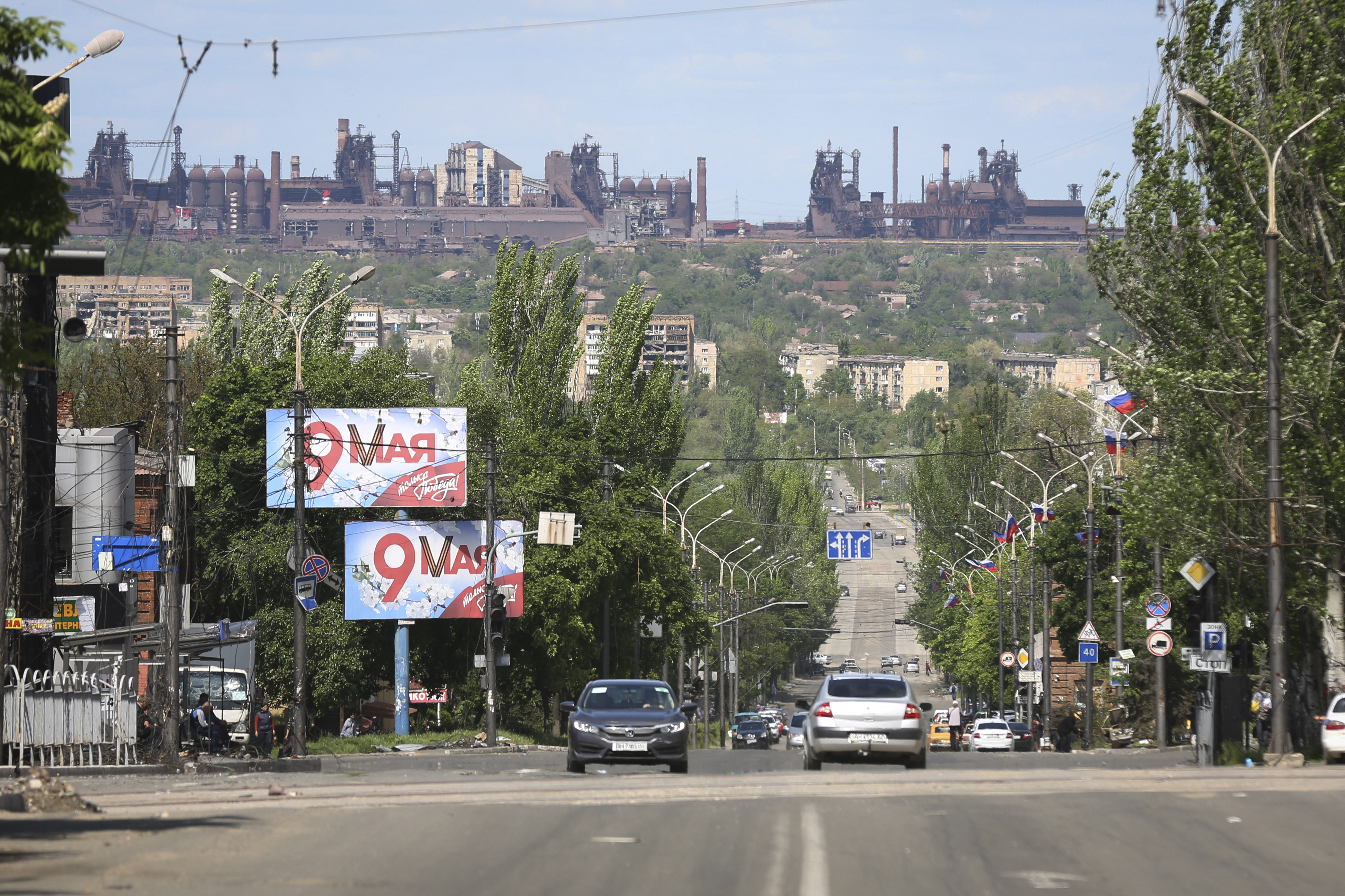 A view of a street in Mariupol, captured by Russian forces, with the Azovstal steel plant in the background. Tuesday, May 17, 2022