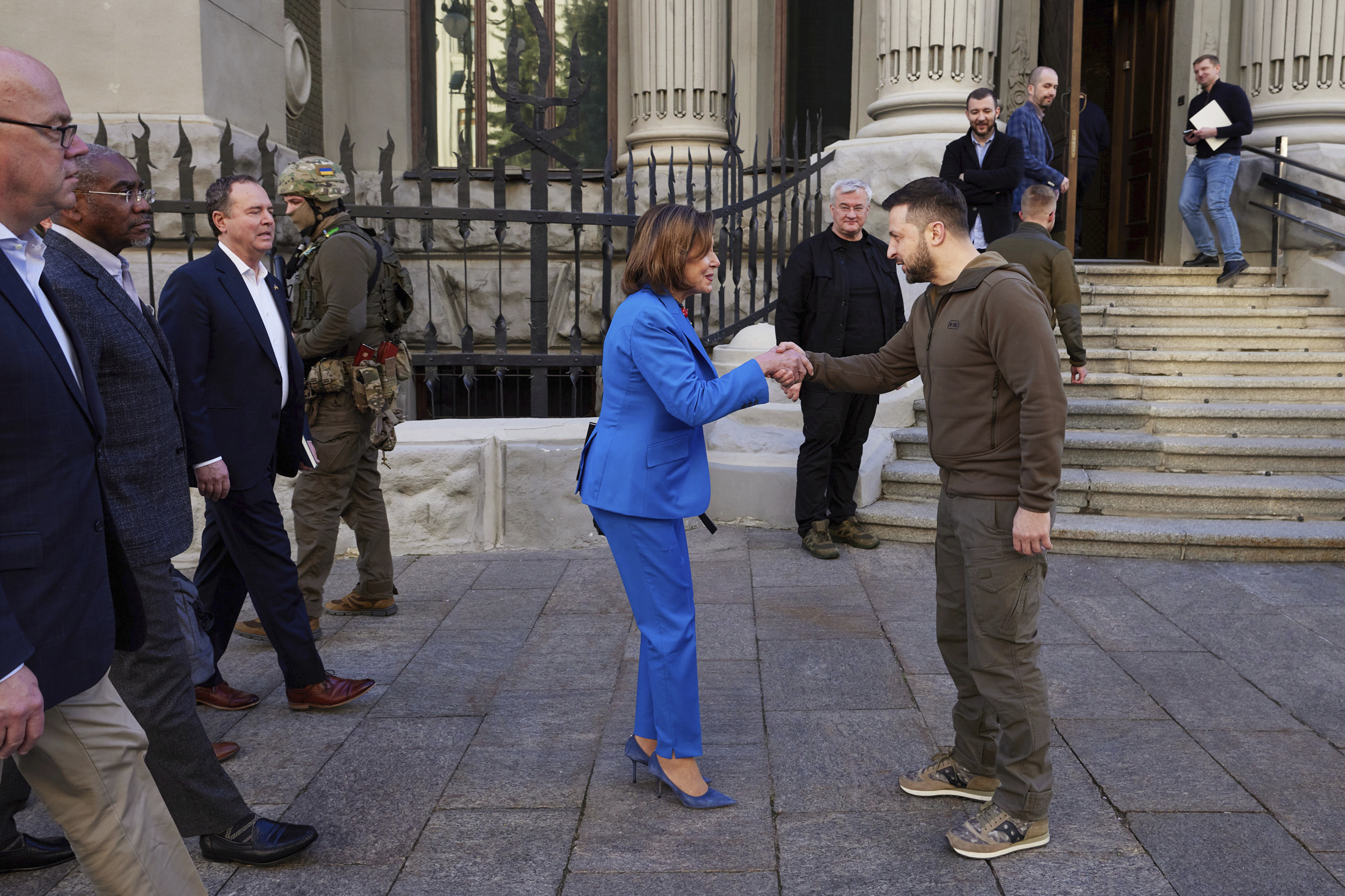 House Speaker Nancy Pelosi shakes hands with Ukraine's president