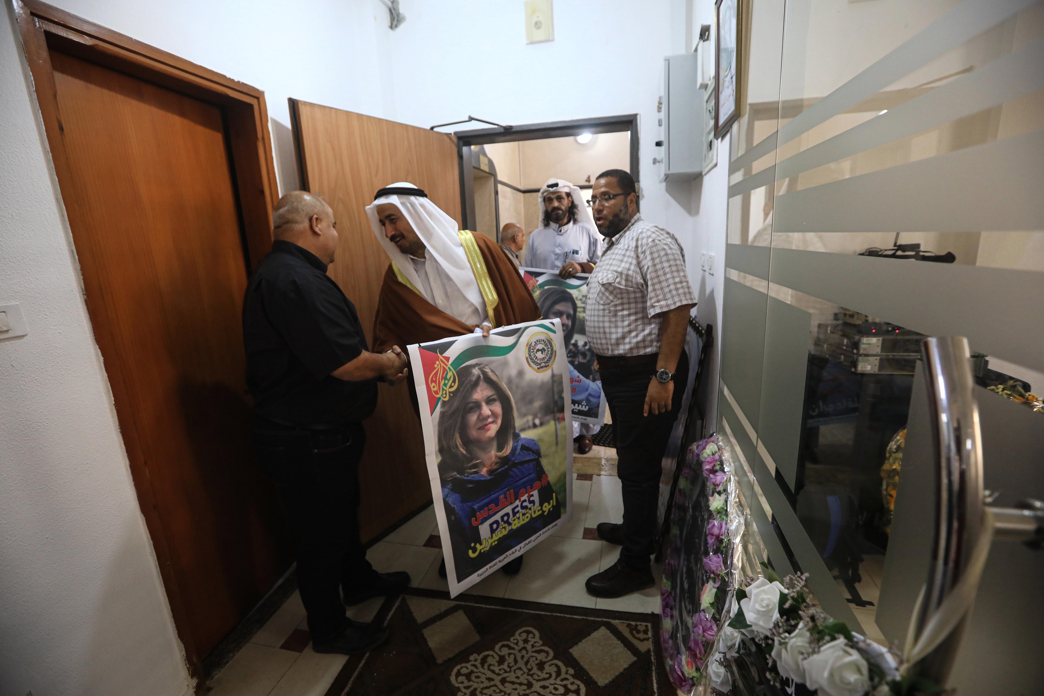 Wael Al Dahdouh receives visitors who came to Al Jazeera’s office to offer condolences after the death of Shireen Abu Akleh