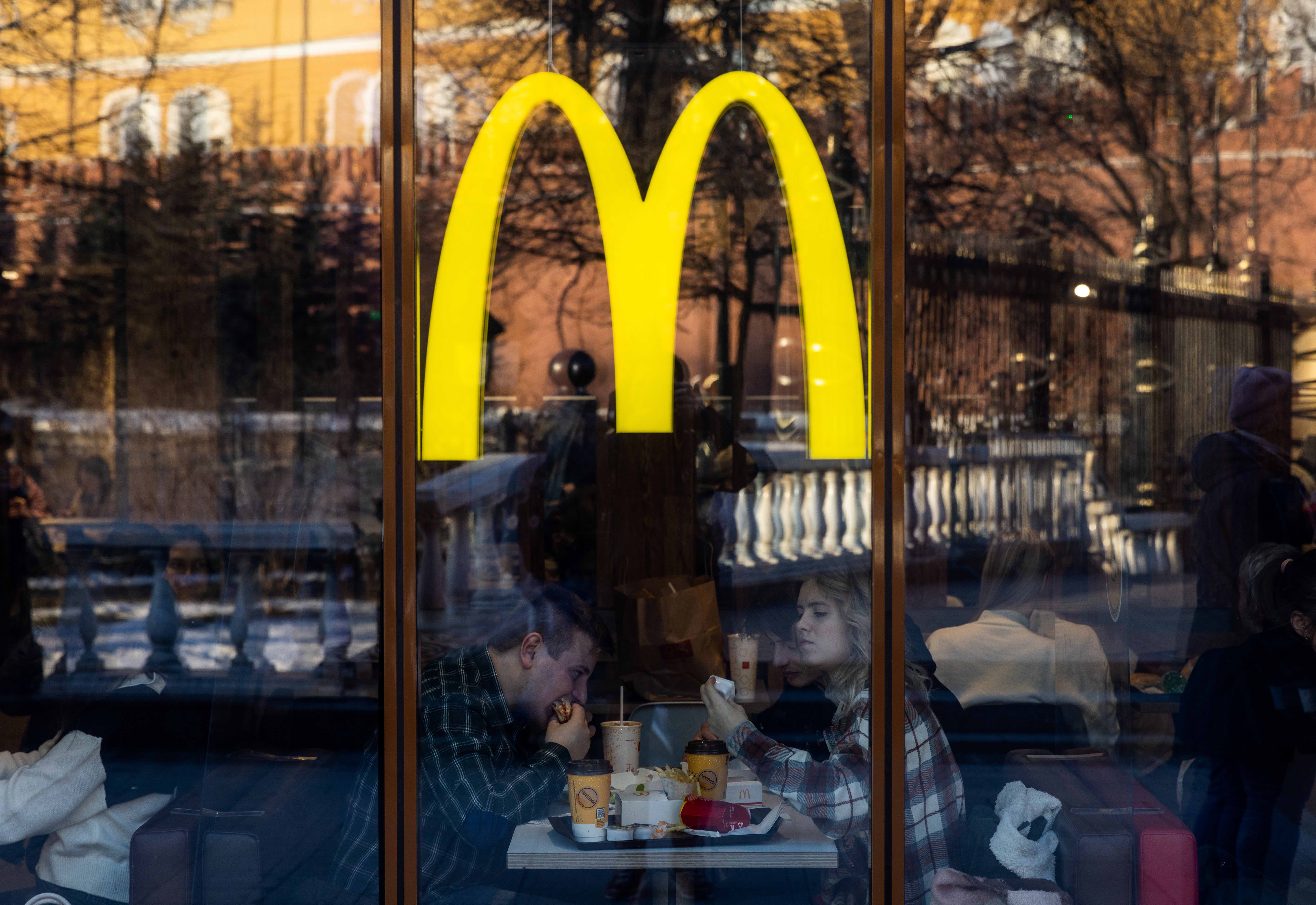 People eat in a McDonald’s restaurant near the Kremlin in central Moscow, Russia