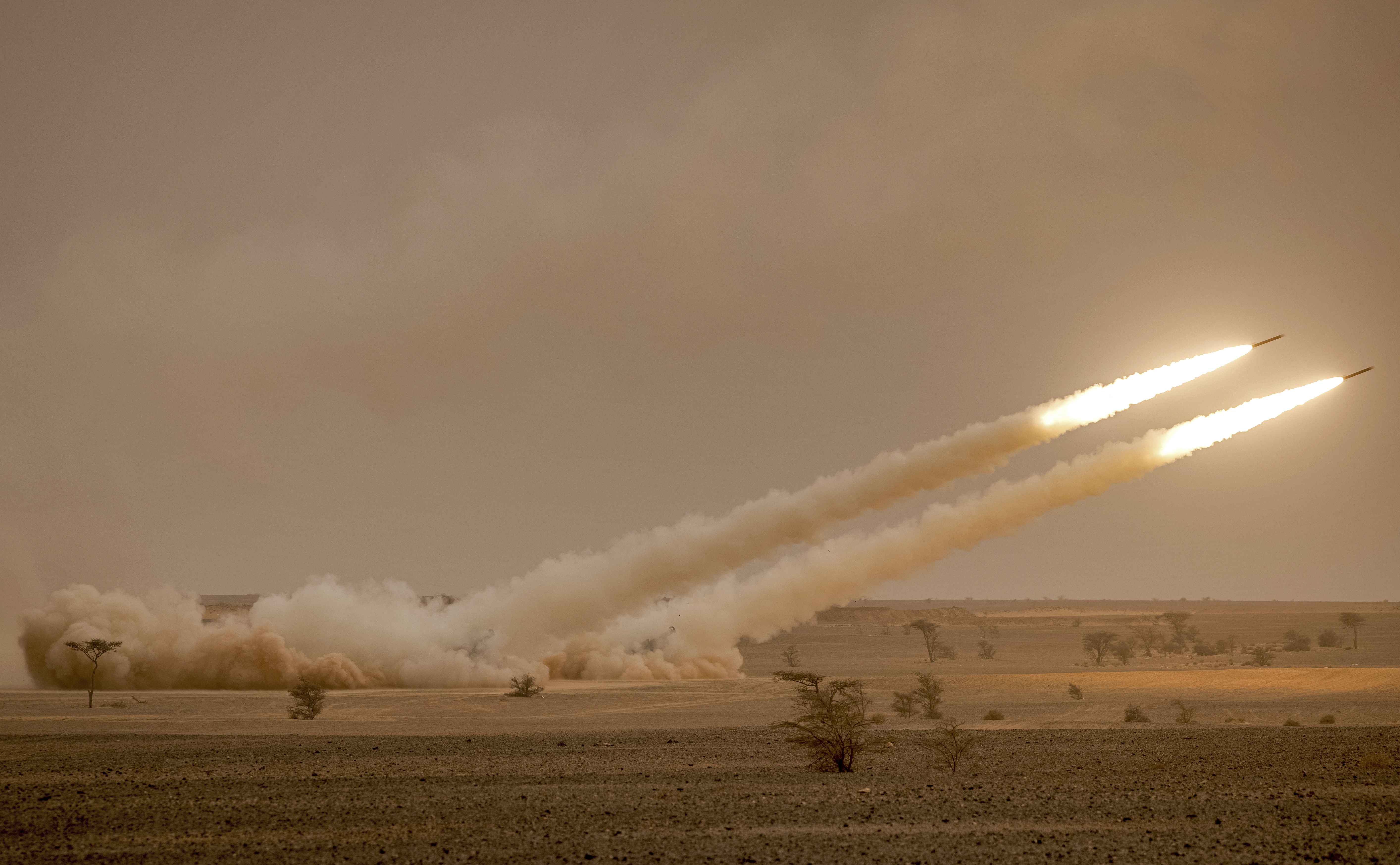 US M142 High Mobility Artillery Rocket System (HIMARS) launchers fire salvoes