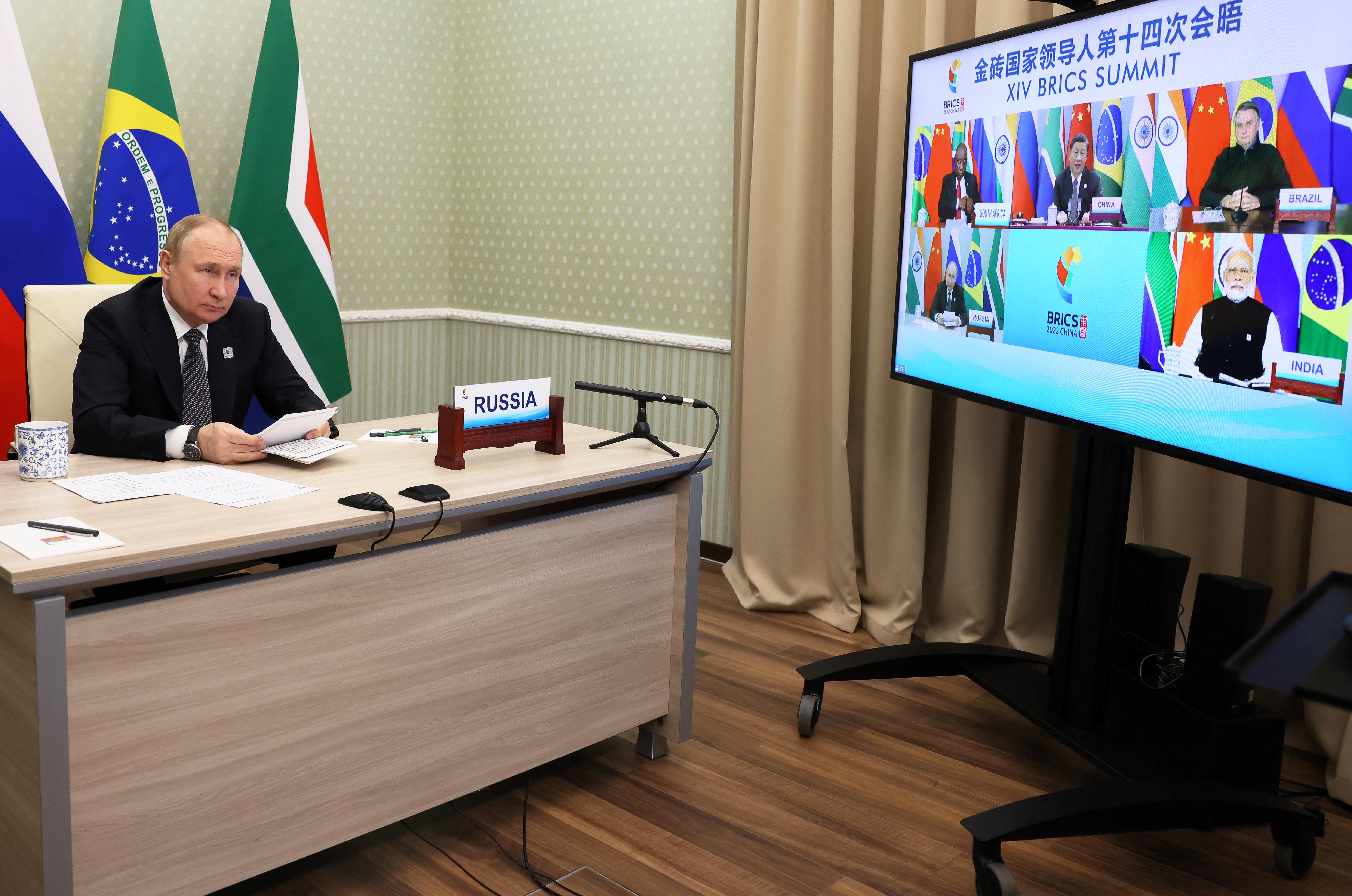 Russian President Vladimir Putin takes part in the BRICS summit in virtual format via a video call in Moscow [Mikhail Metzel via AFP]