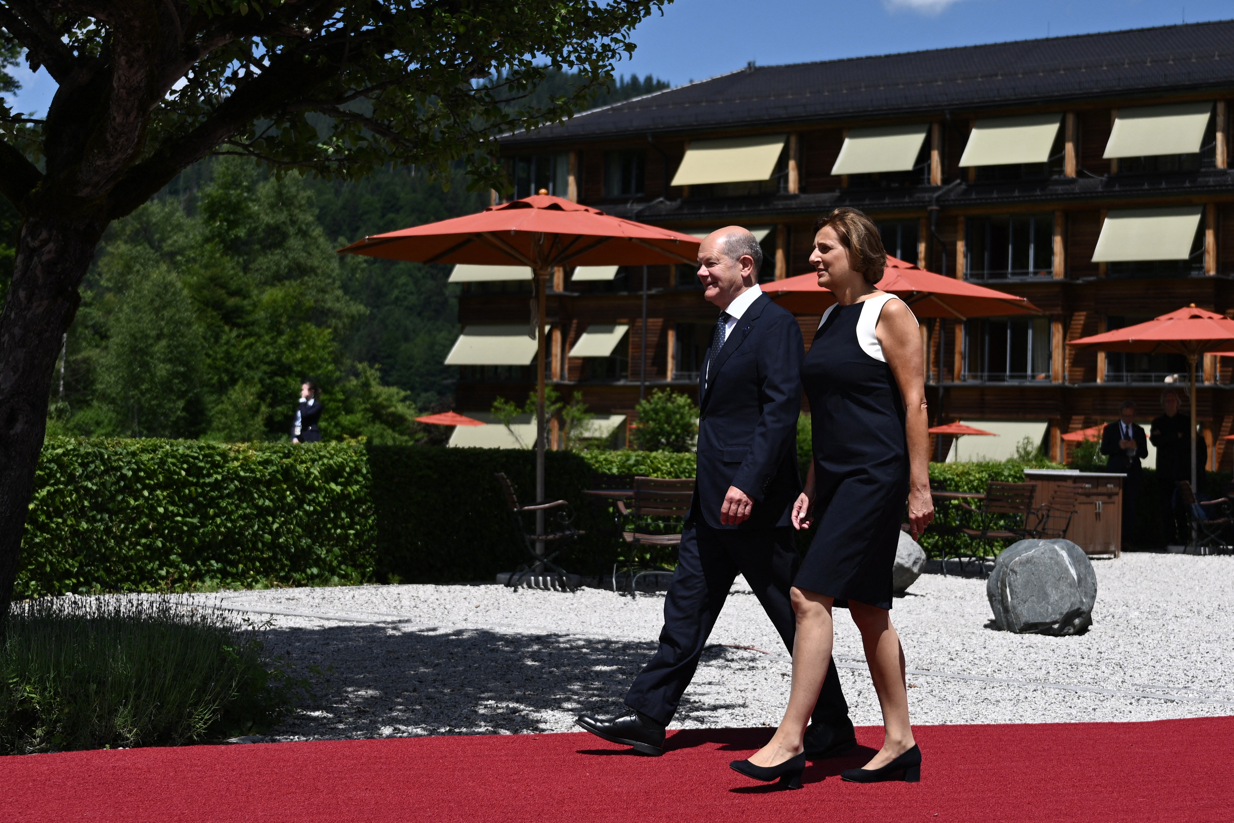 Germany’s Chancellor Olaf Scholz and his wife Britta Ernst arrive to welcome participants for the start of the G7 Summit at Elmau Castle, southern Germany, on June 26, 2022