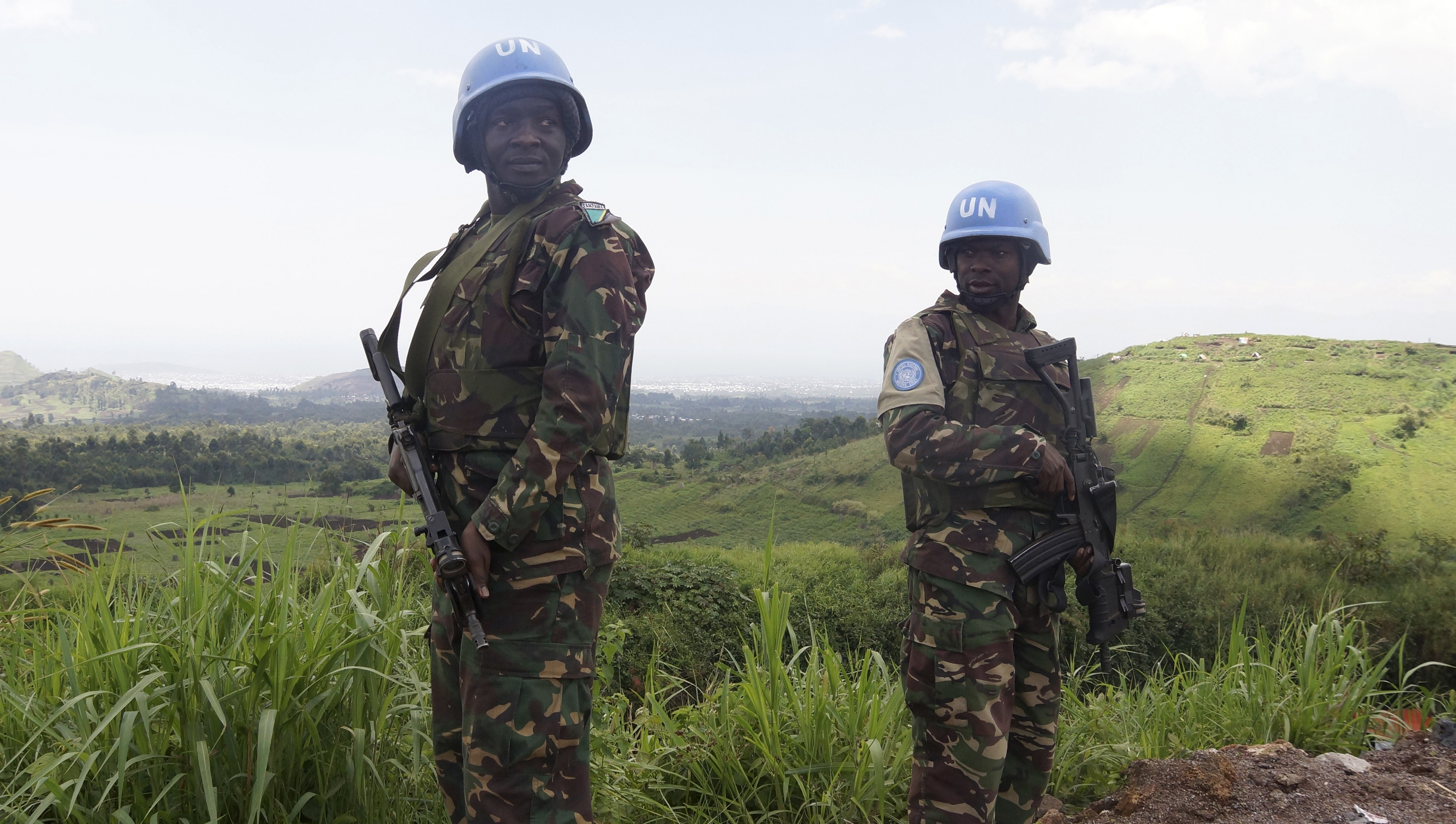 UN peacekeepers from Tanzania hold their weapons as they patrol outside Goma during a visit by officials from the UN Security Council in the eastern DRC