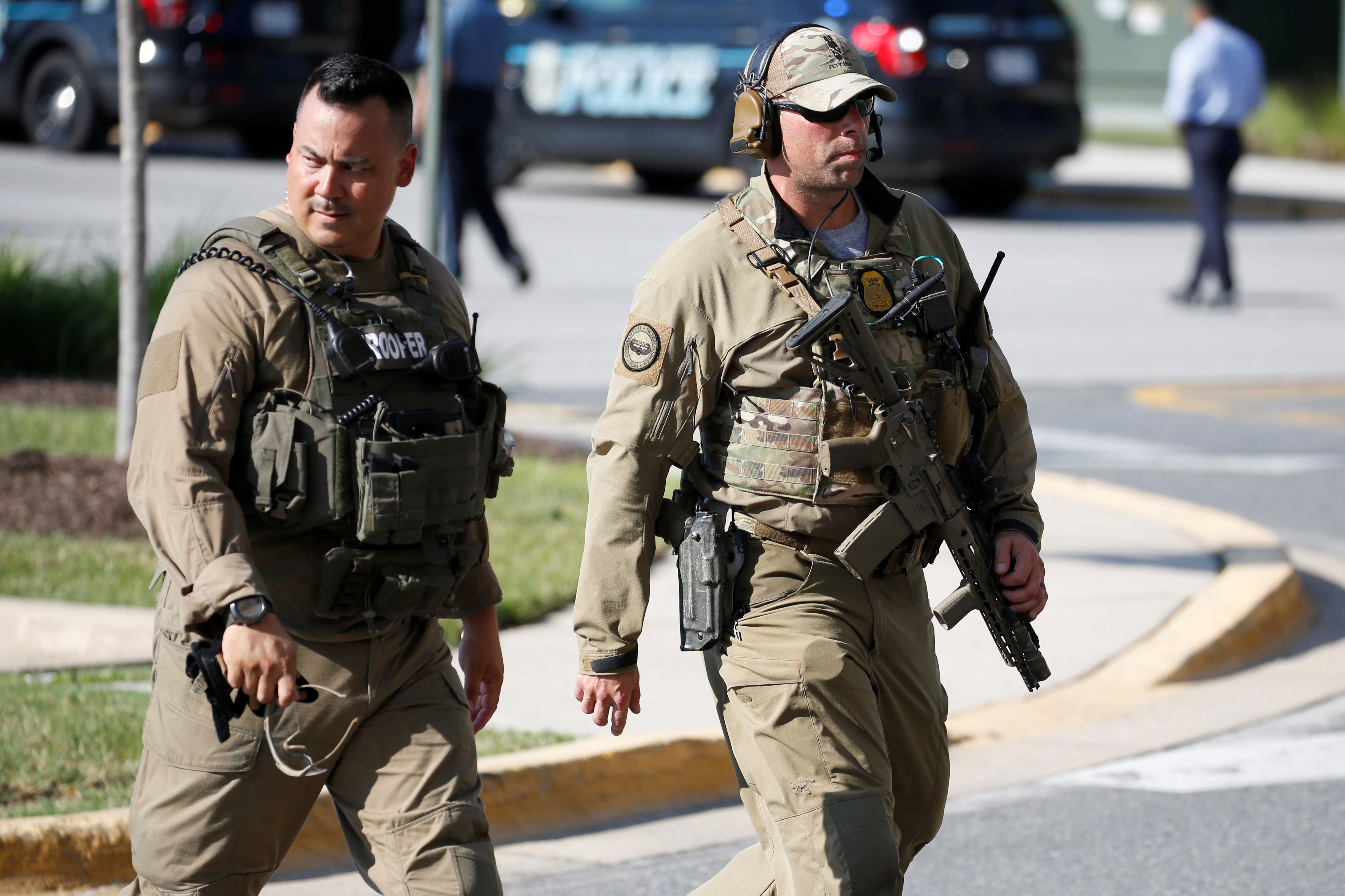 Police gather after a gunman opened fire .