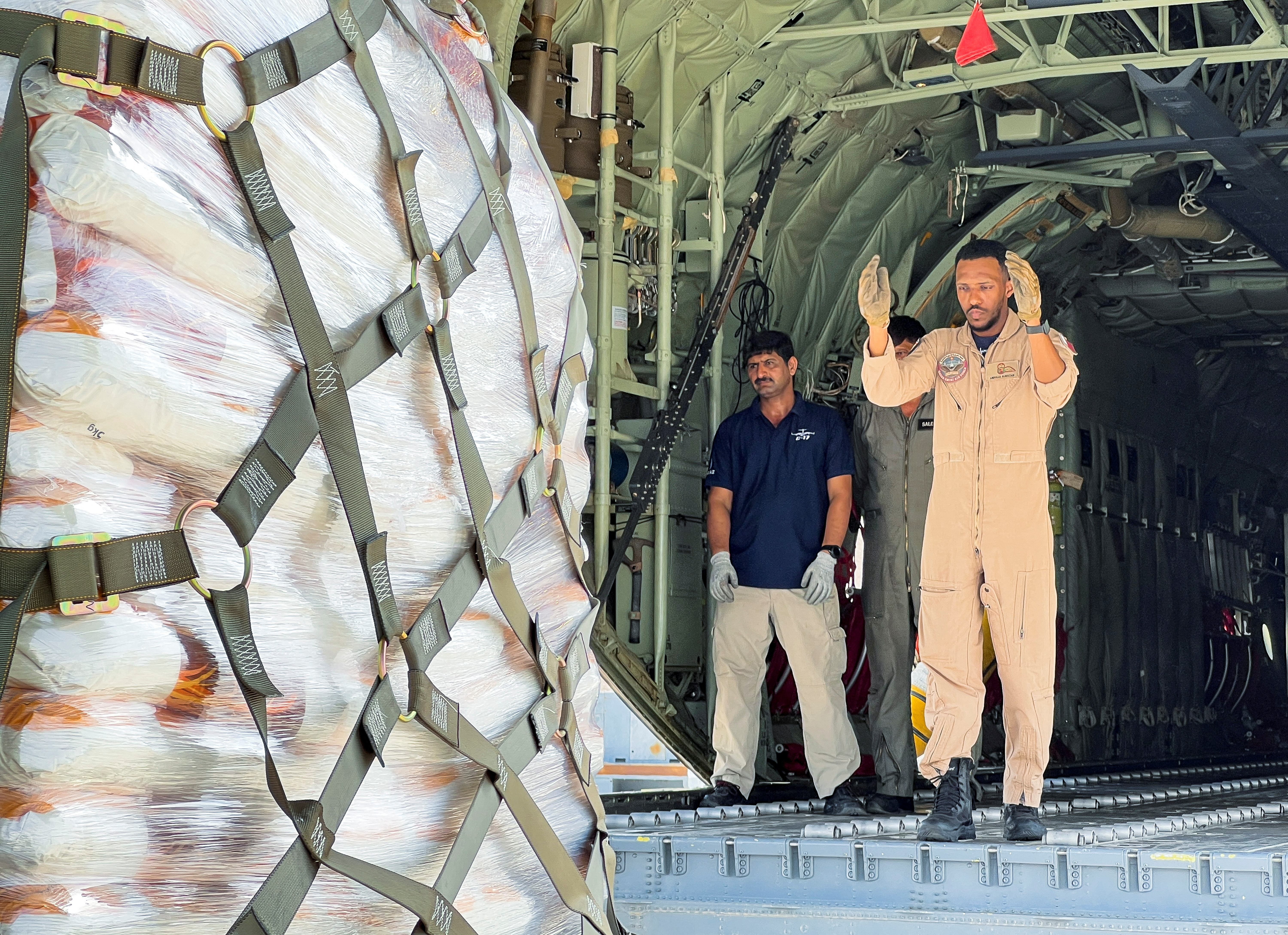 Humanitarian aid scheduled to go to Khost is loaded onto a plane in Al Udeid Air Base in Qatar