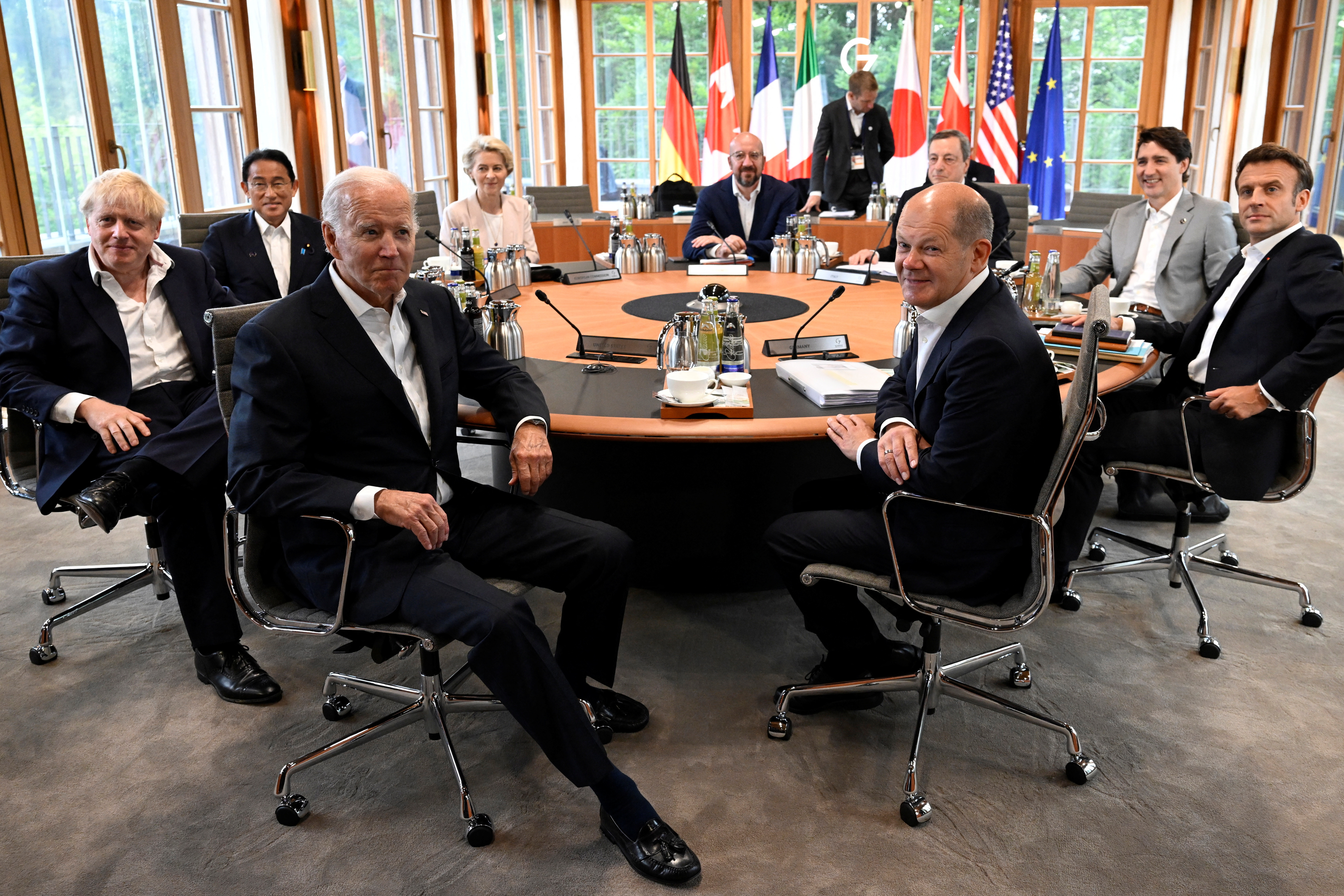 British Prime Minister Boris Johnson, Japan's Prime Minister Fumio Kishida, US President Joe Biden, European Commission President Ursula von der Leyen, European Council President Charles Michel, Germany's Chancellor Olaf Scholz, Italy's Prime Minister Mario Draghi, Canada's Prime Minister Justin Trudeau and France's President Emmanuel Macron attend a meeting alongside the G7 leaders summit at Bavaria's Schloss Elmau, near Garmisch-Partenkirchen, Germany