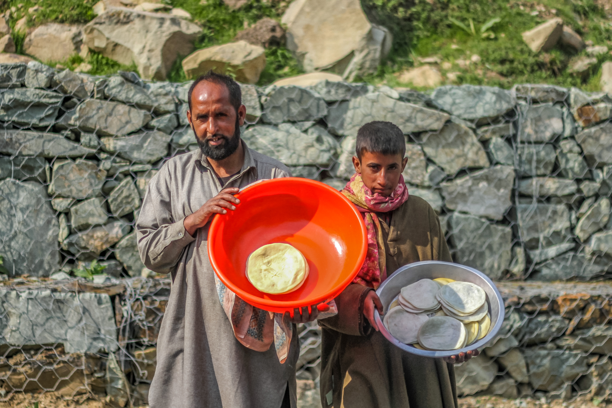 Shepherd Farooq Ahmad and his nephew Faizan sell kalari nearby. He has been buying it from the Gujjars and selling at markets for the past three decades, selling 200 to 300 a week