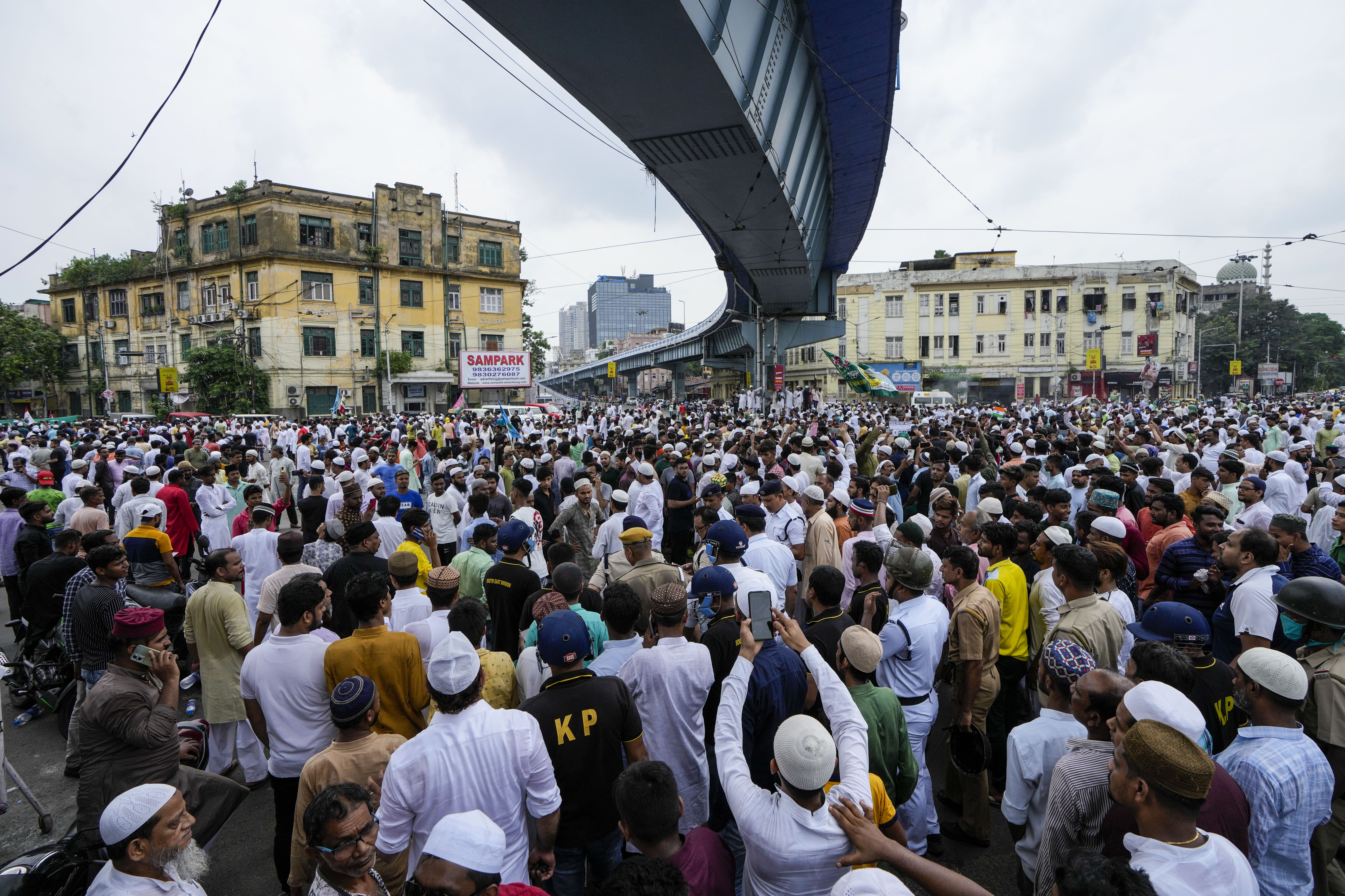 Indian Muslims block road as they protest against the spokesperson of governing Hindu nationalist party.