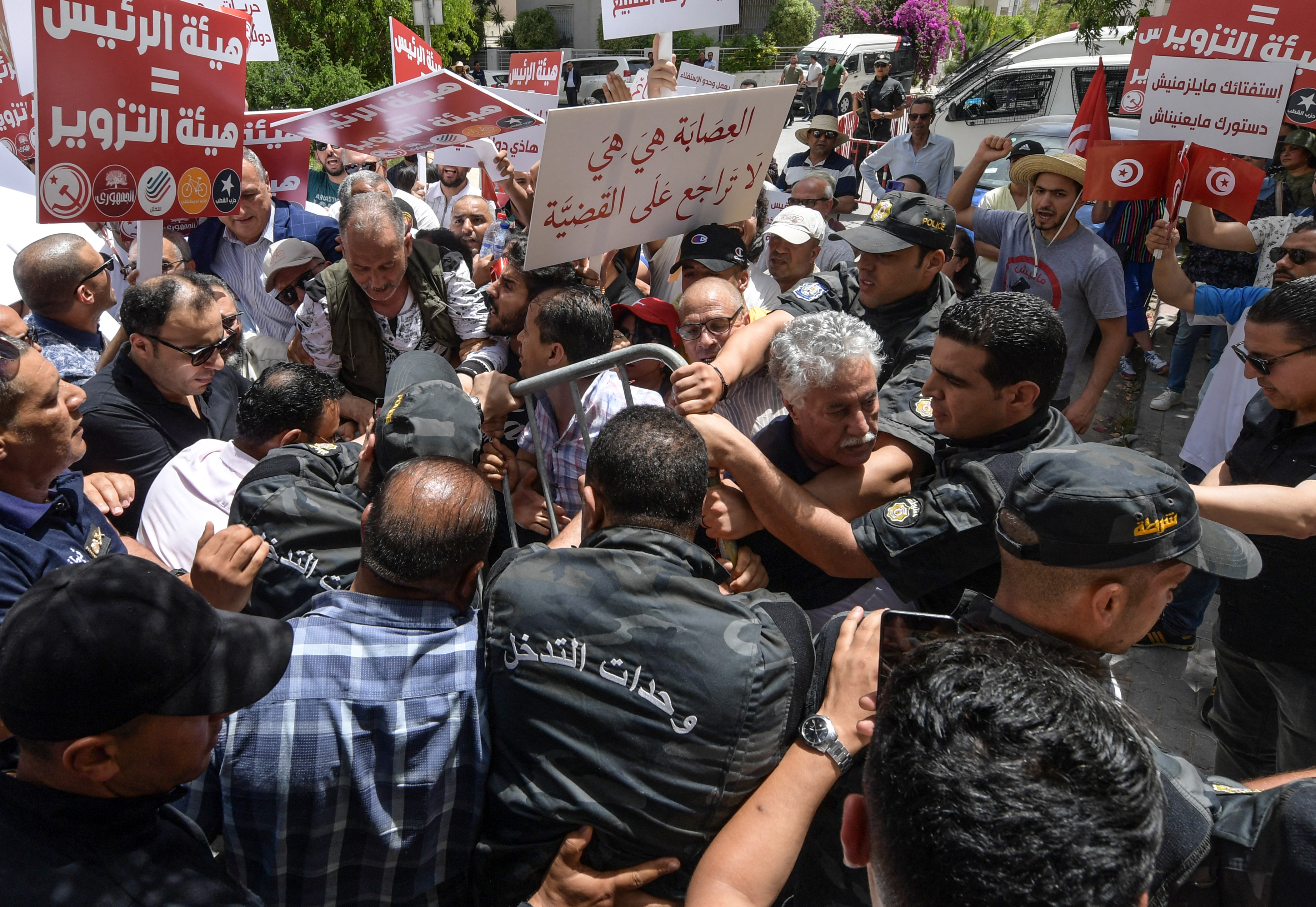 Scuffles broke out between police and demonstrators who were protesting a referendum planned for July by President Kais Saied