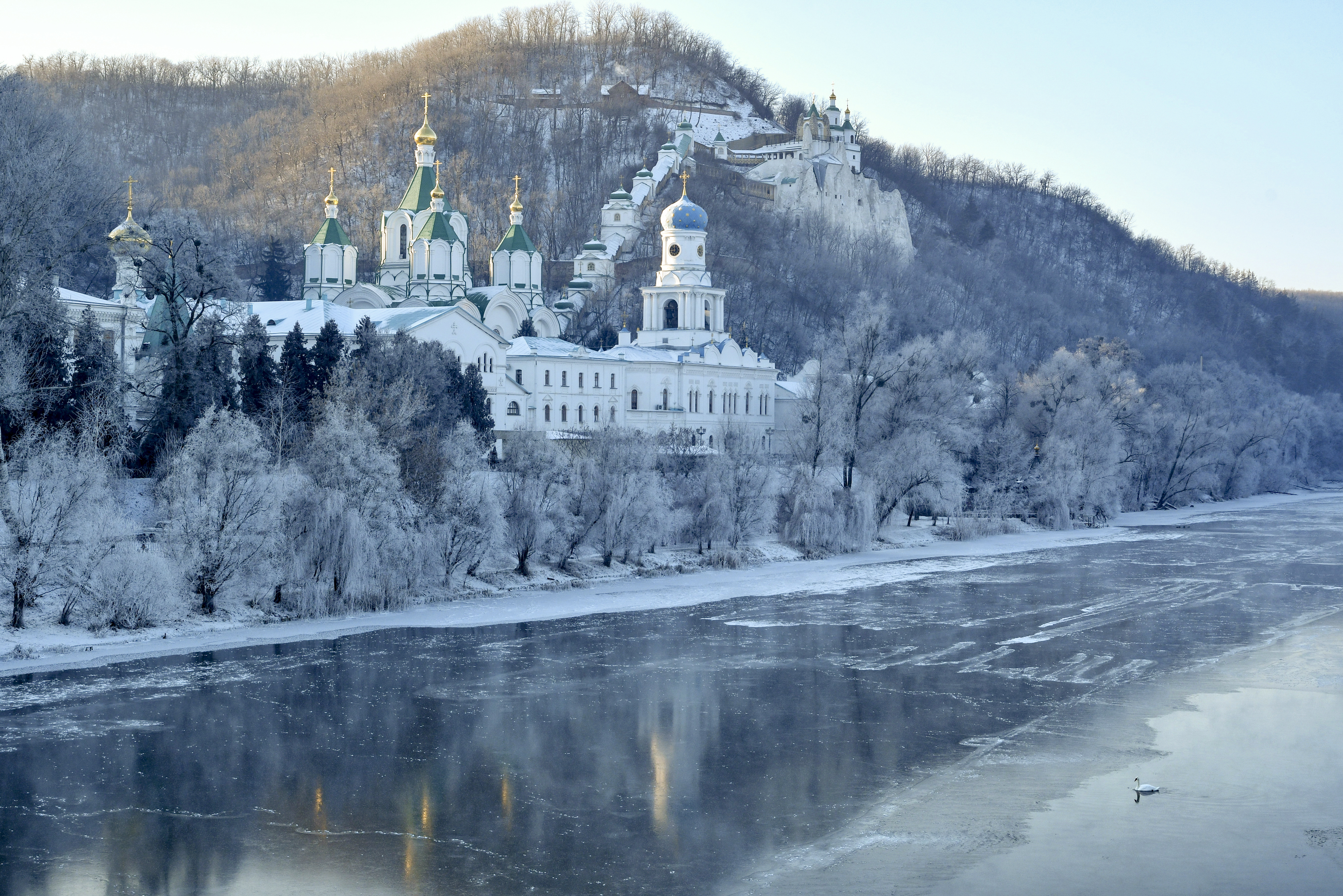 The Holy Mountains Lavra of the Holy Dormition, an Orthodox Christian monastery, during winter sunrise on the steep right bank of the Siverskyy Donets river near the town of Sviatohirsk in the Donetsk region of eastern Ukraine, on Friday, December 24, 2021