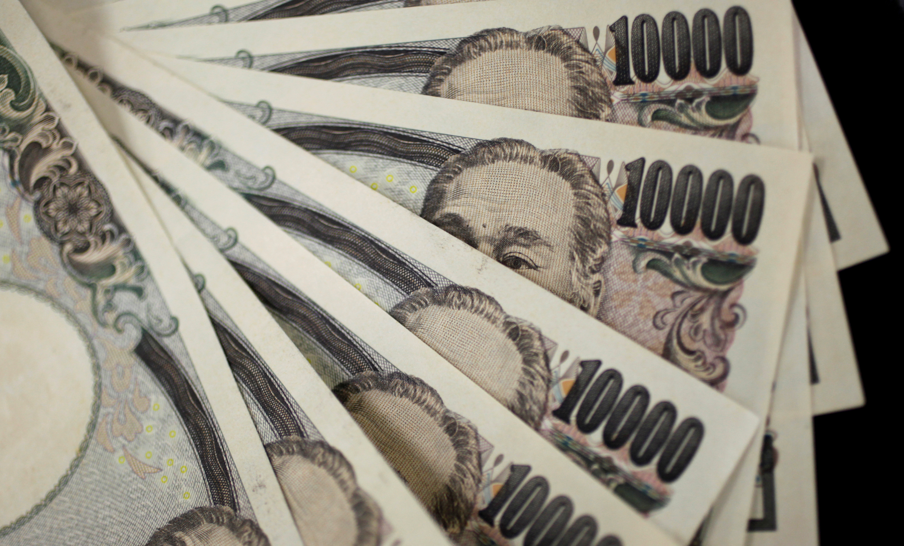 Japanese ichiman-en (10,000 yen) bills.