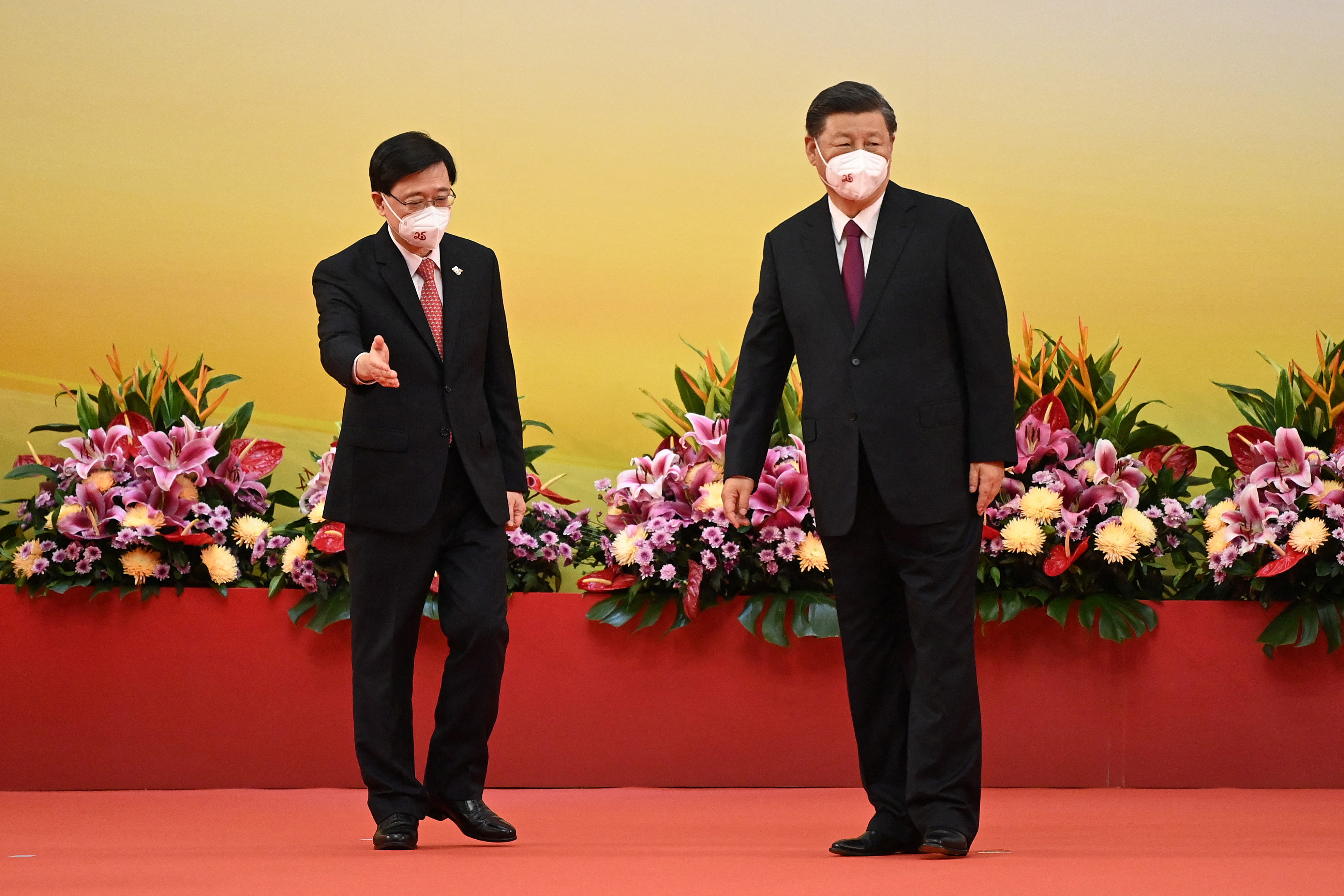 John Lee (left), with China’s President Xi Jinping, has made security his priority and is planning a Hong Kong version of Beijing’s security law
